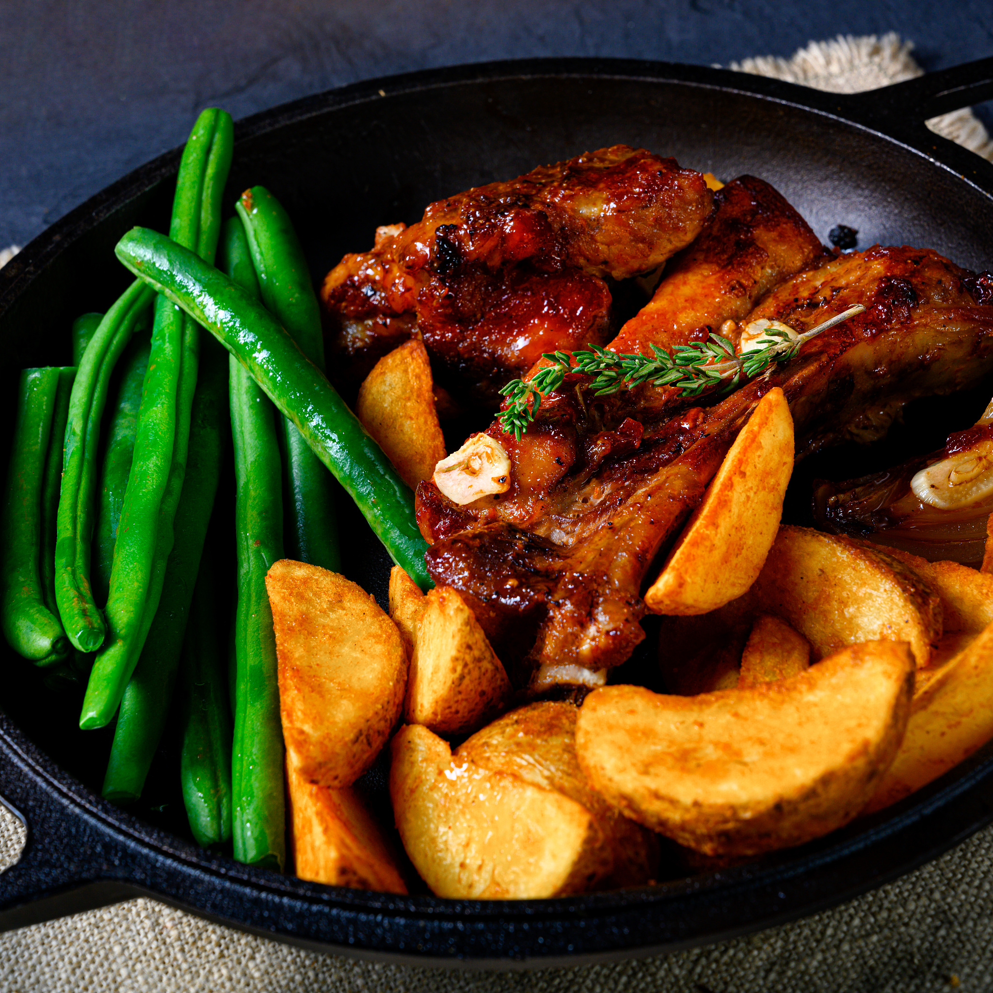 rib of pork with beans and quarter potato