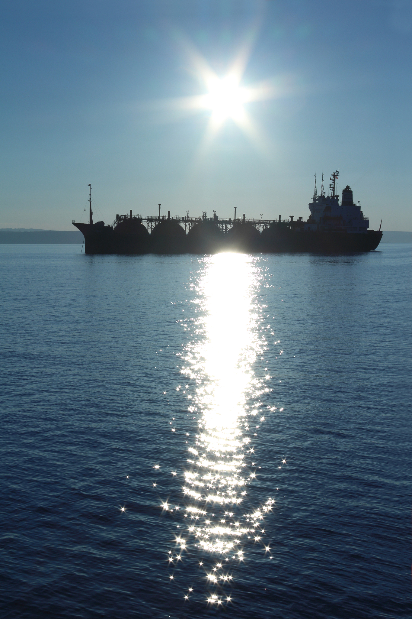 silhouette tanker at night