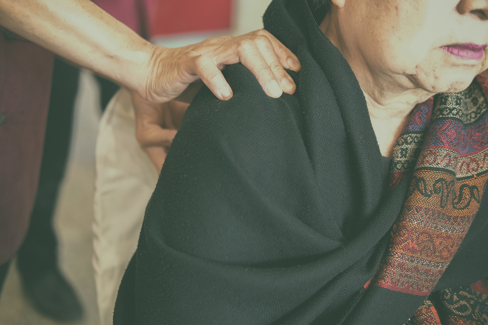 physiotherapist massage old woman shoulder