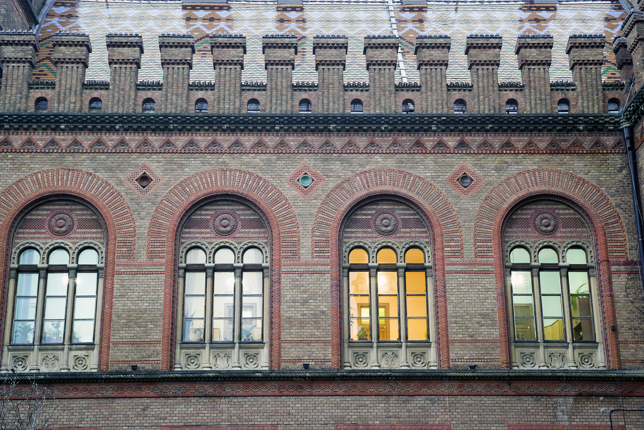 arched windows, red brick building ornamental details