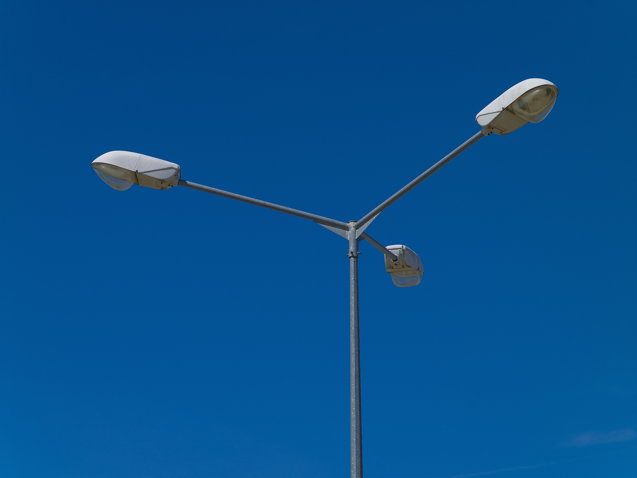 street lamp against the blue sky