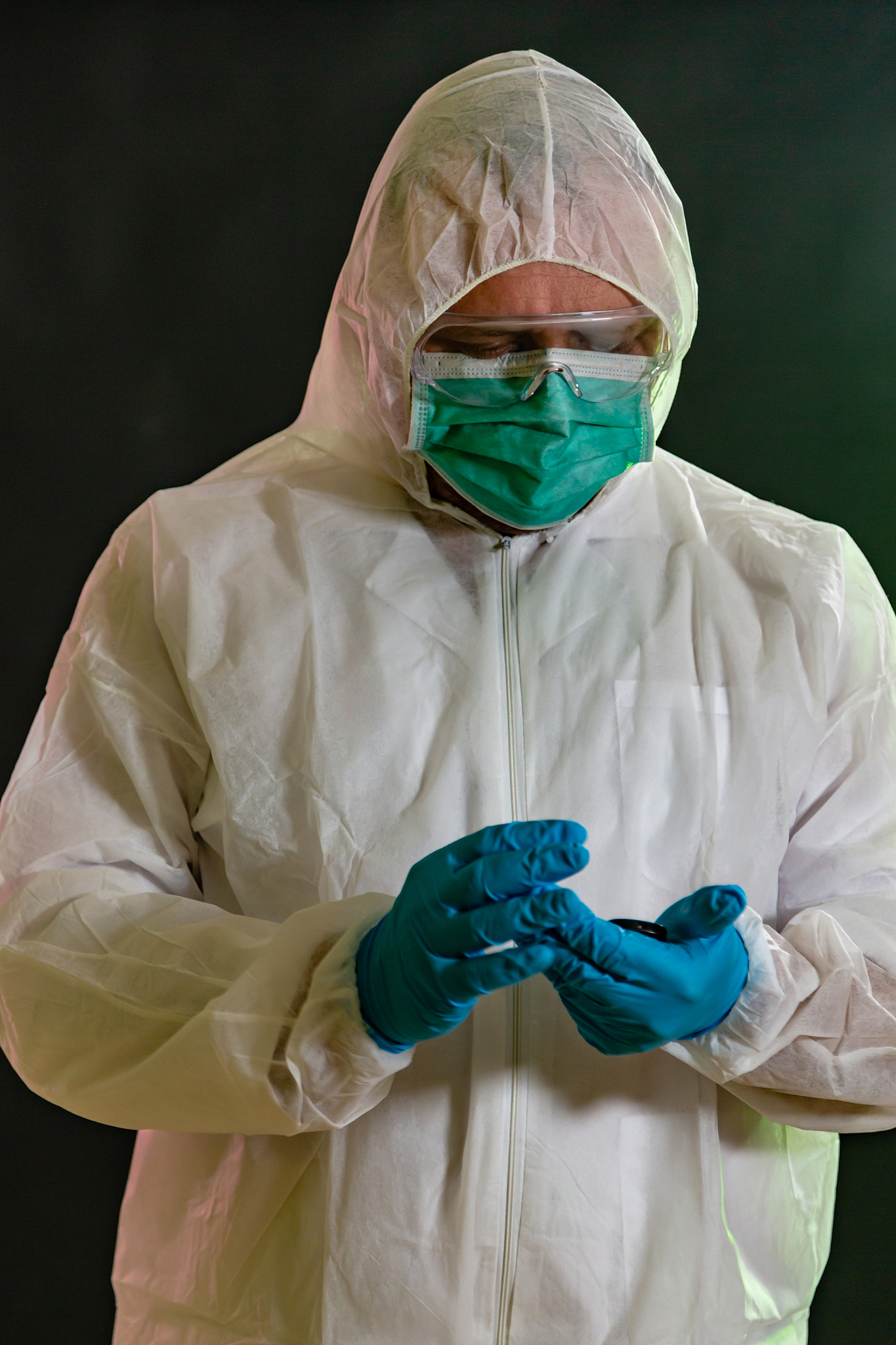 man in chemical suit measures toxicity levels