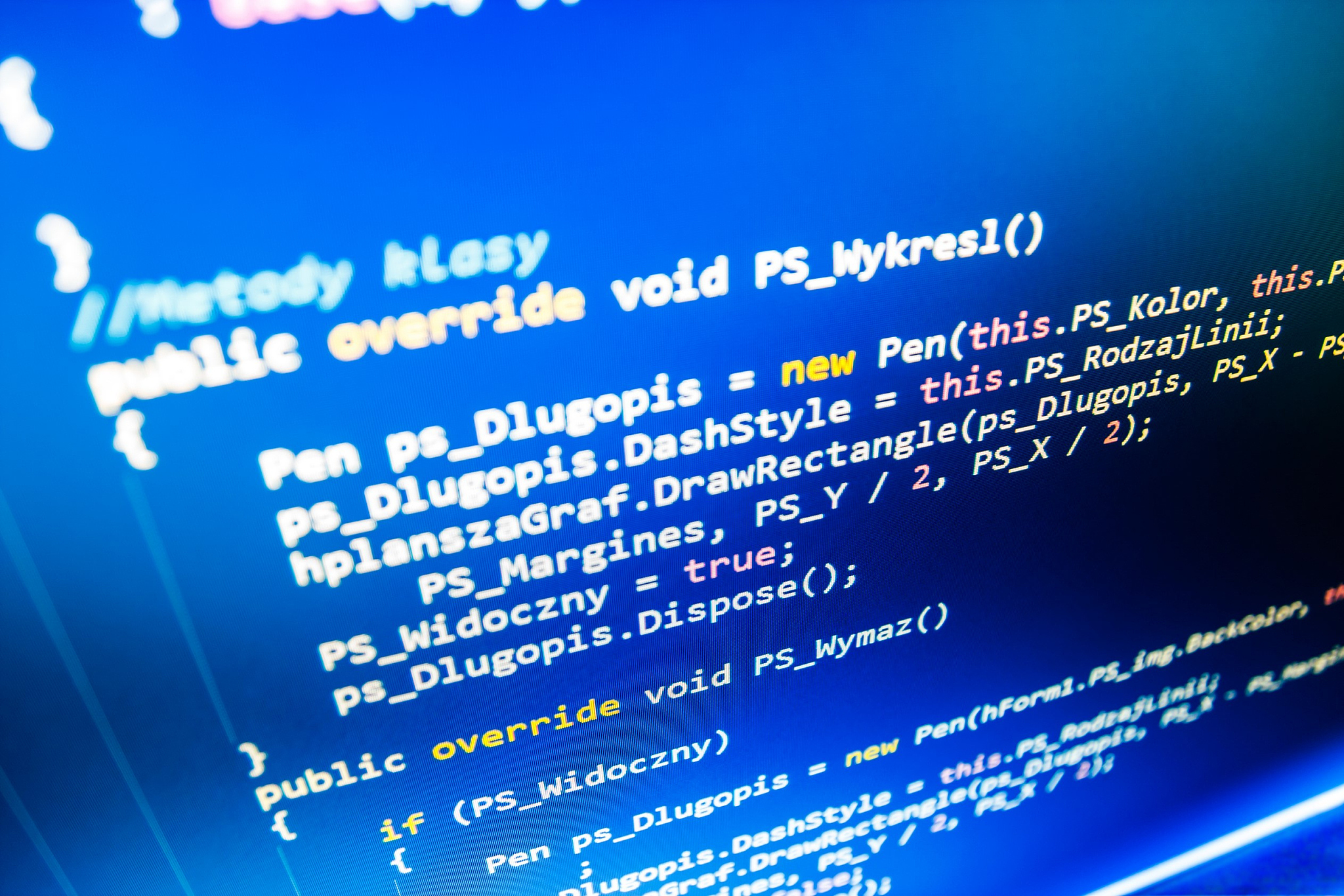 software developer programming code on computer