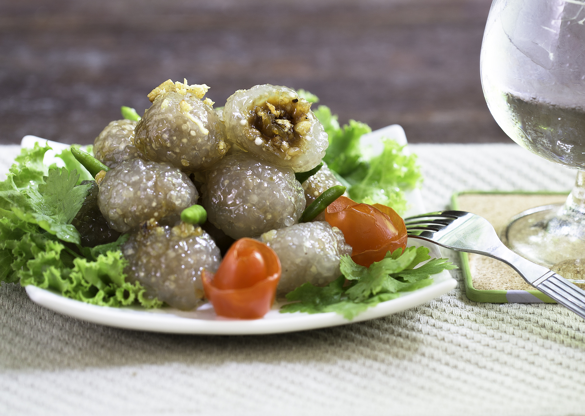 tapioca balls with pork filling and glass of cold water
