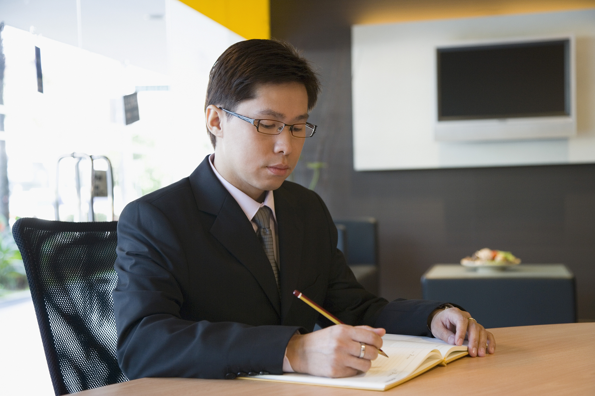 businessman writing in office