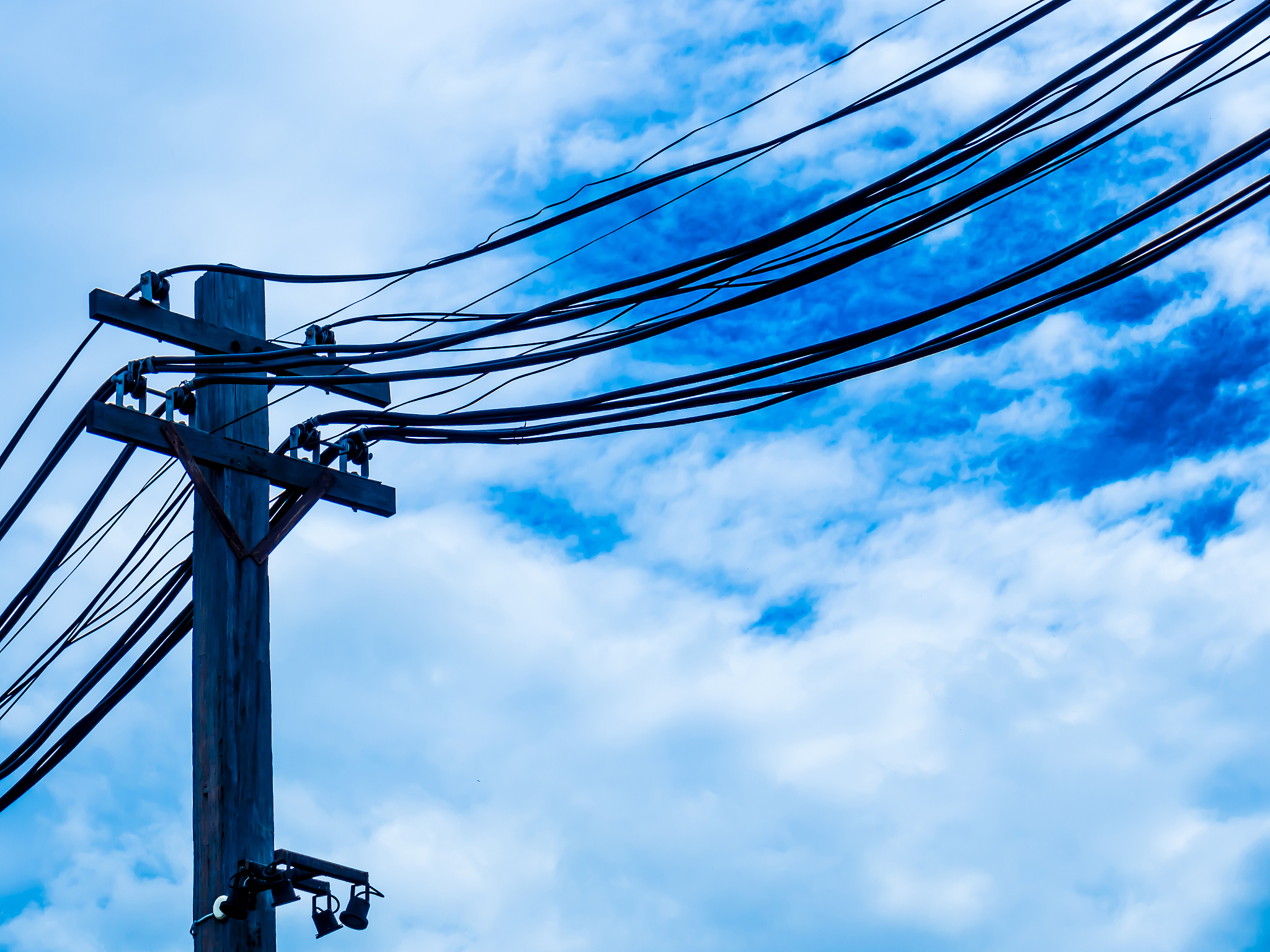 pole with electric and telephone wires