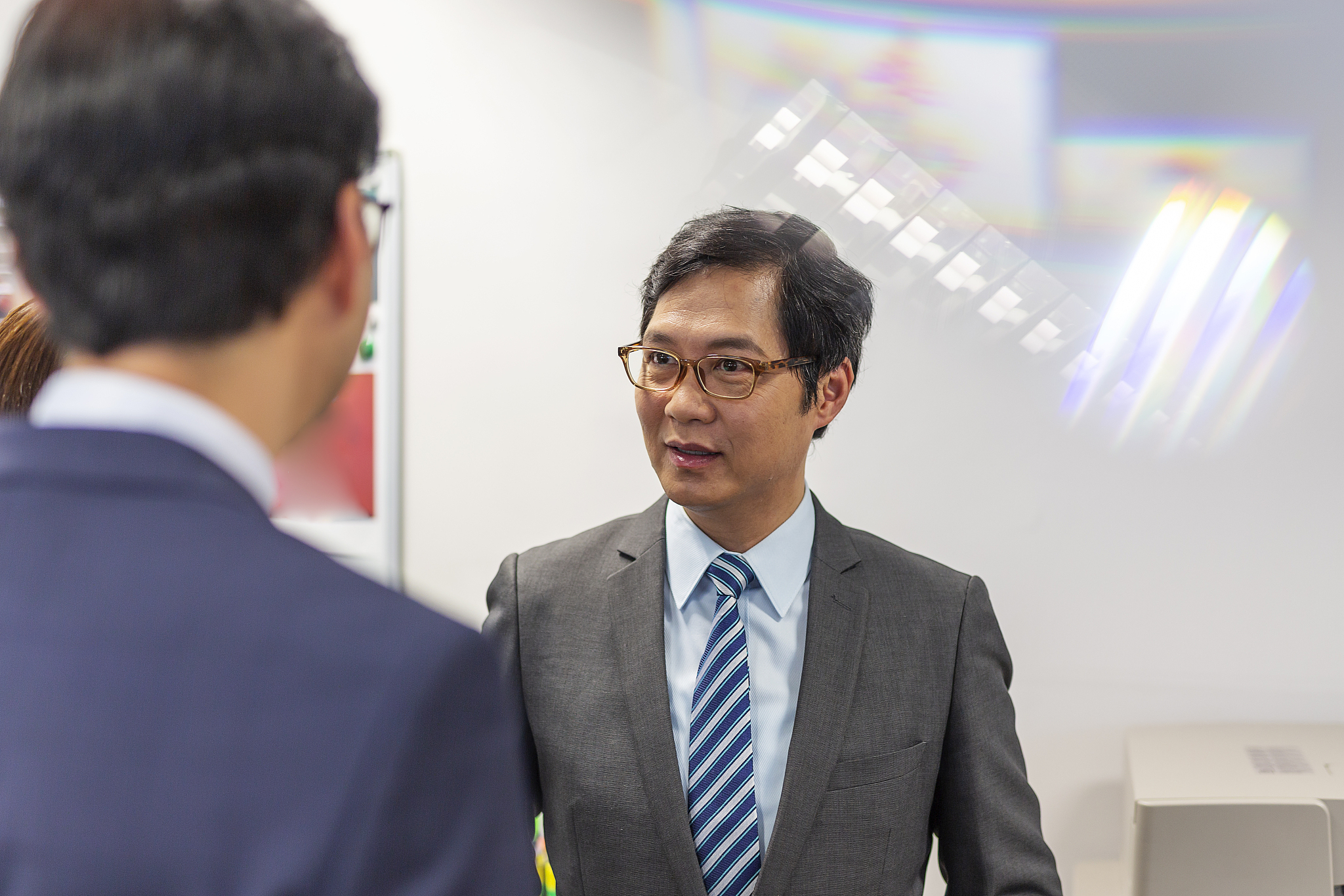 business men talking in an office
