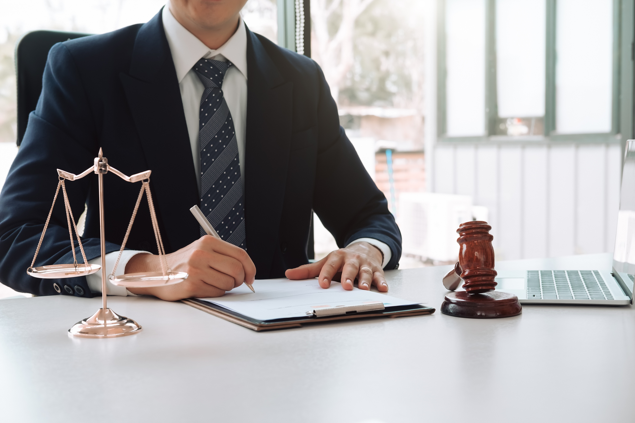 justice and law concept. gavel on sounding block in hand's male 