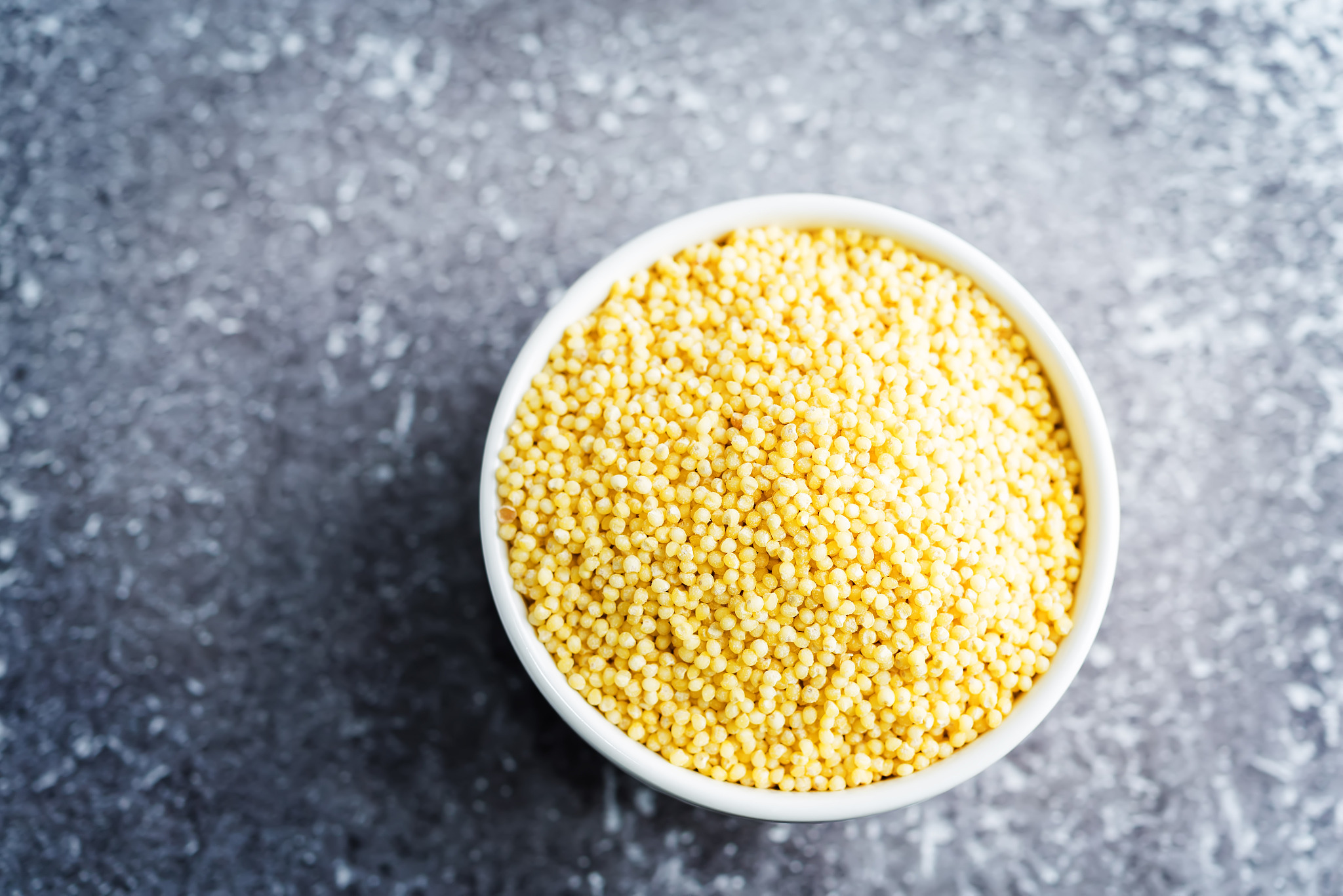 dried millet porridge in the white bowl