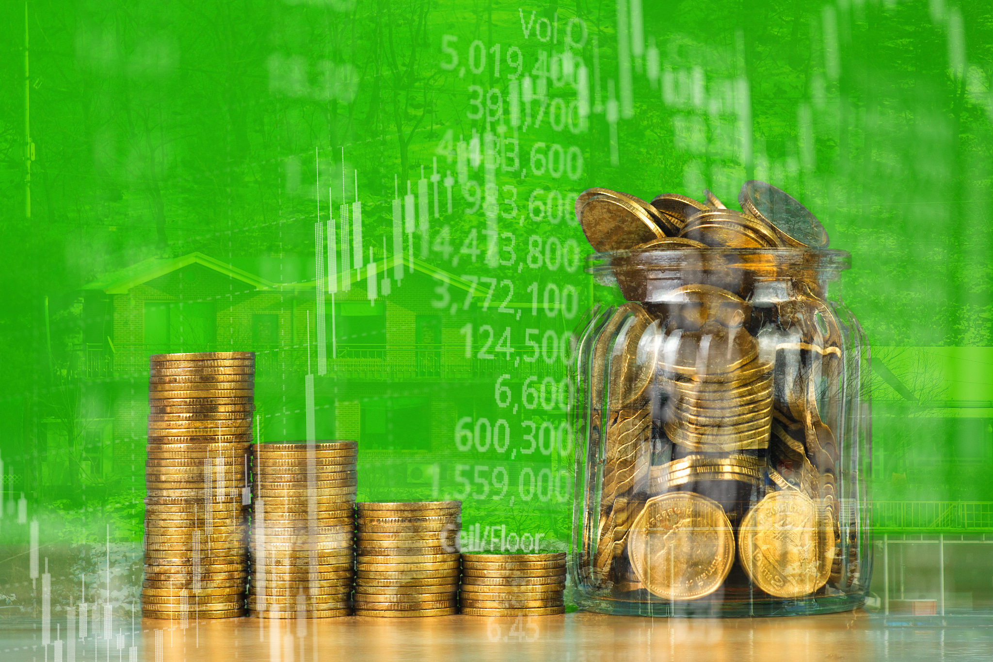 double exposure of coin stack with stock market screen chart boa