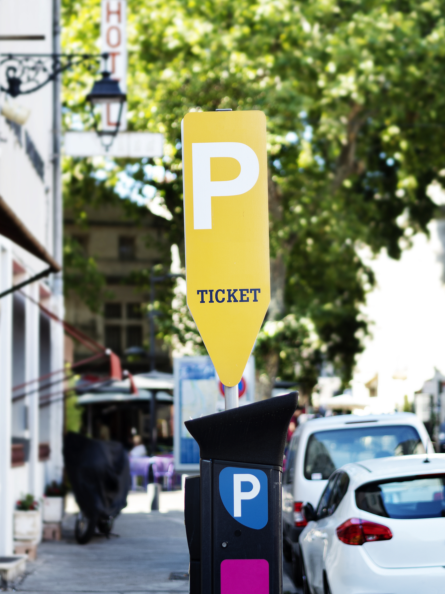 yellow parking ticket machine