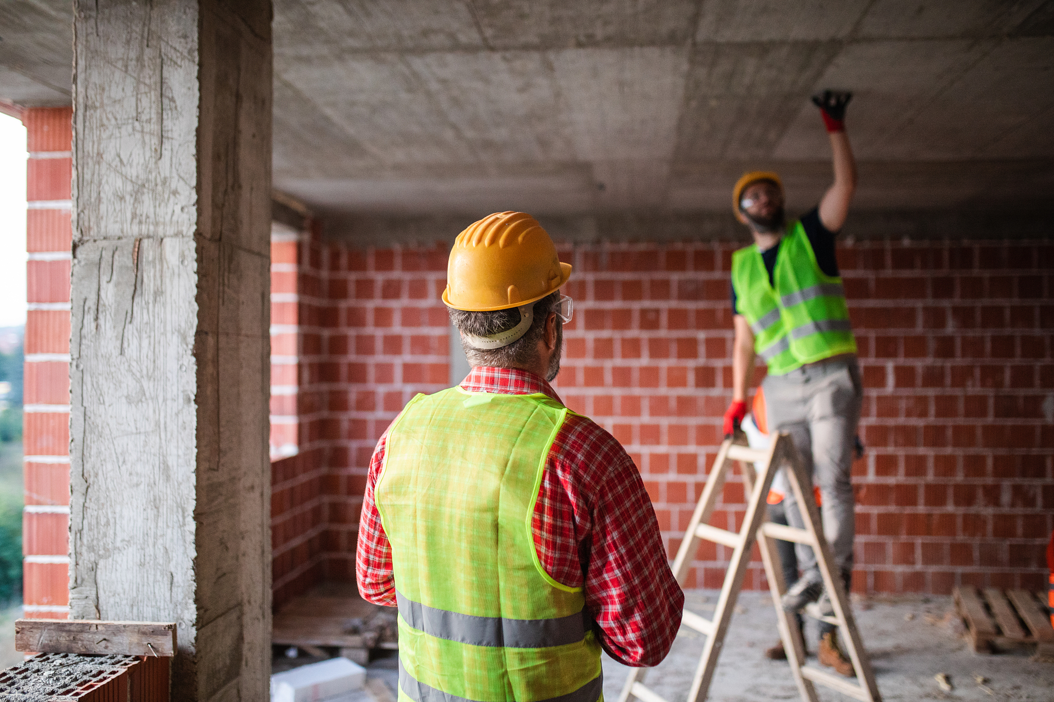 construction worker checking apartment interior design