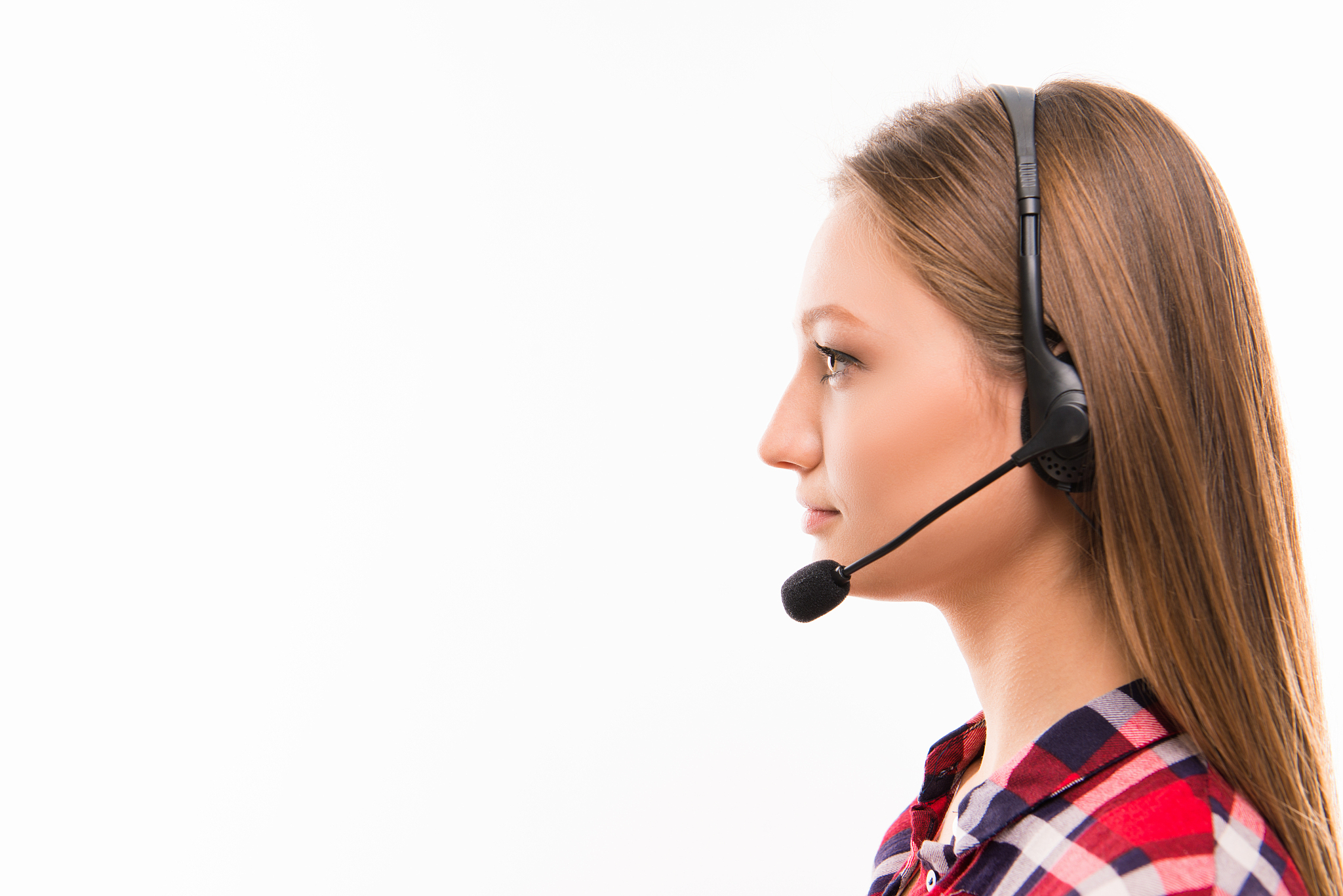 a close-up side-face portrait of a young agent of call centre
