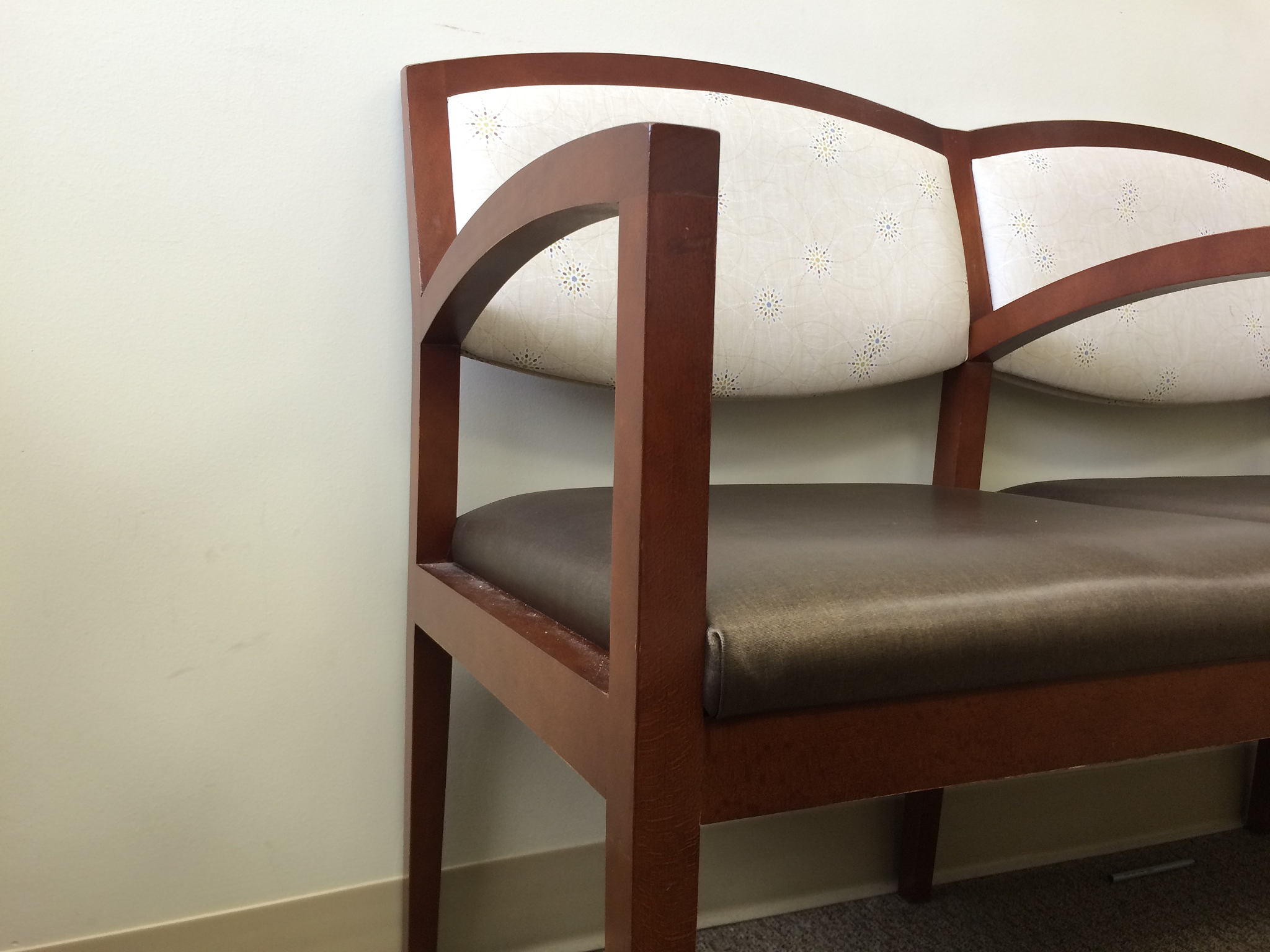empty chairs against white wall