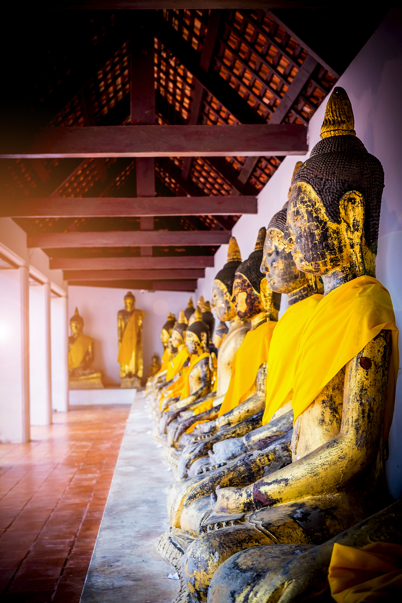image of buddha in old temple of thailand , light and flare effe