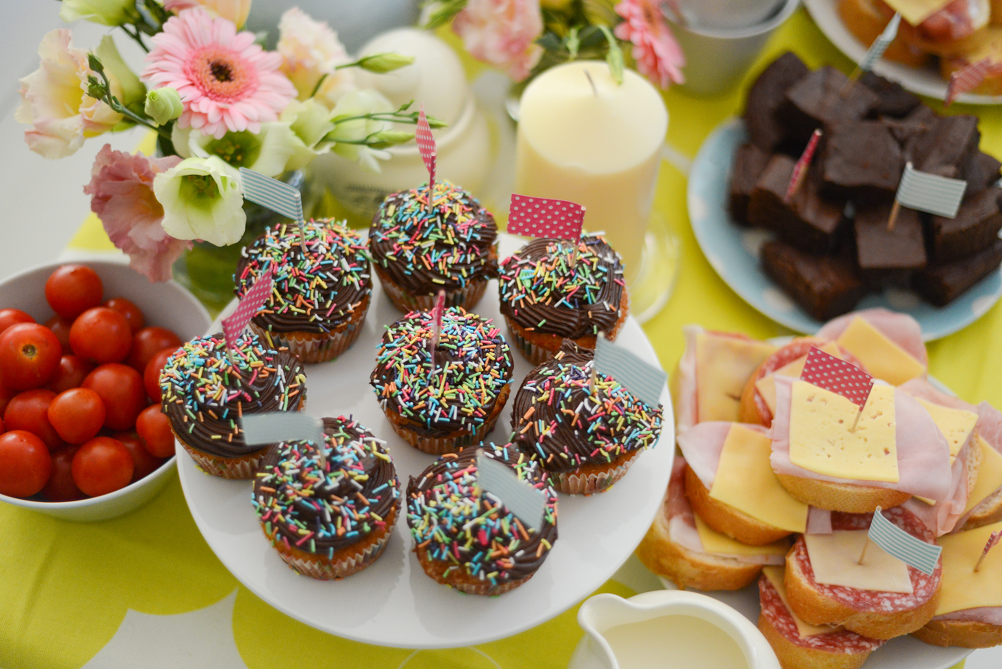 a festively decorated table with a variety of savory and sweet f