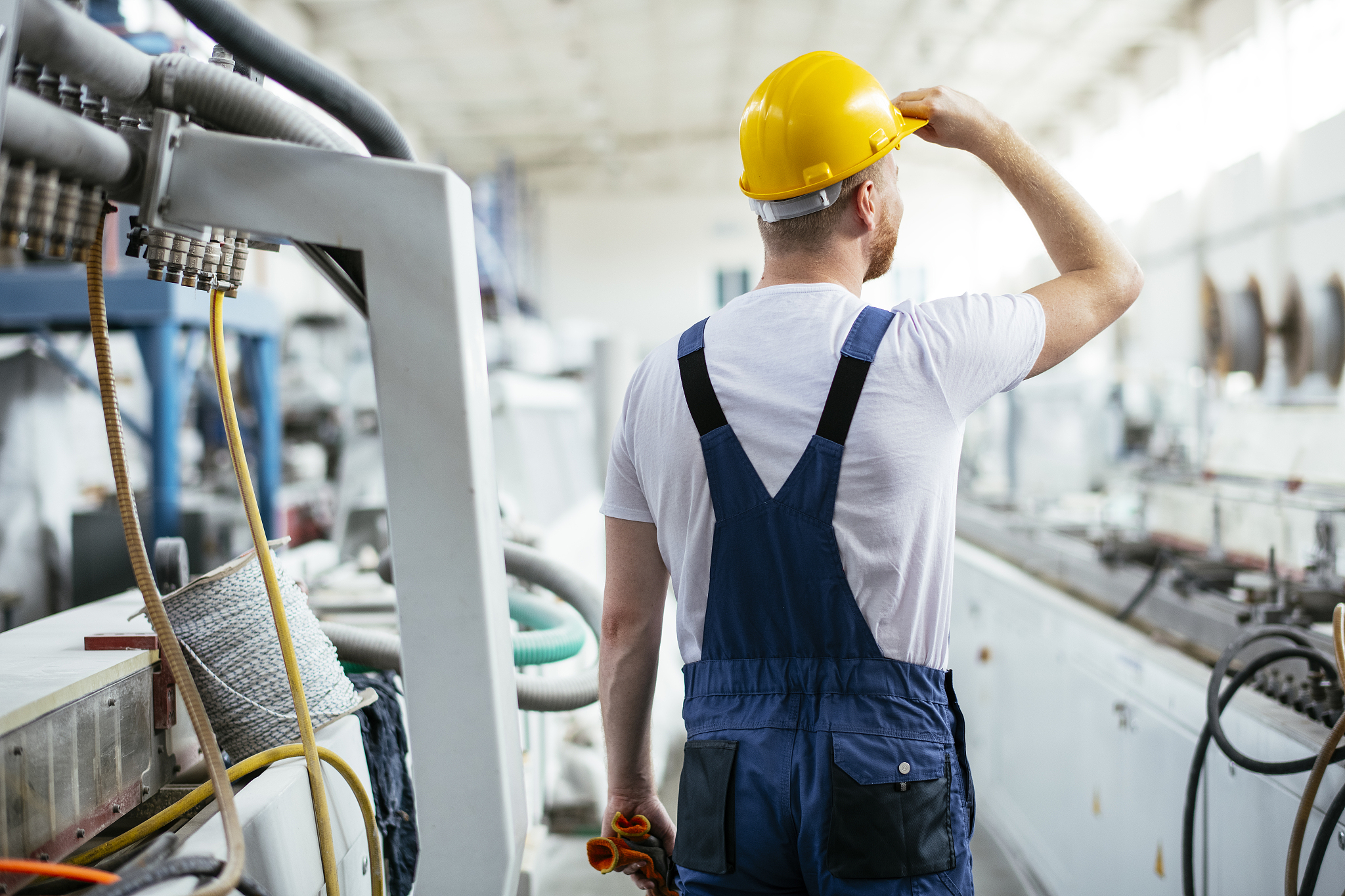 worker in uniform working in factory