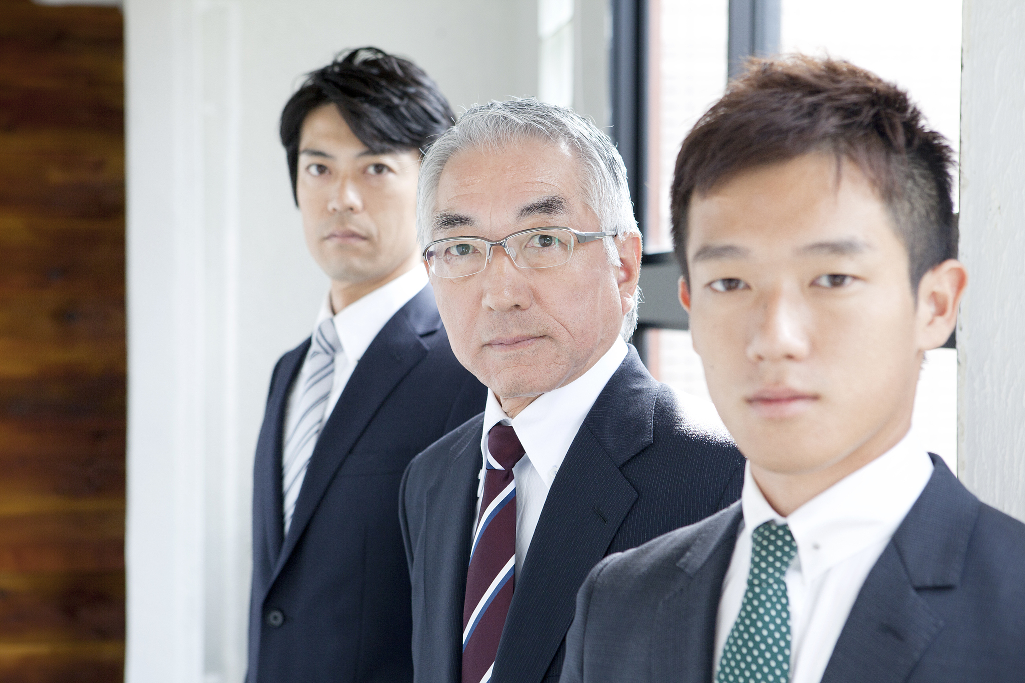 three men making a pose
