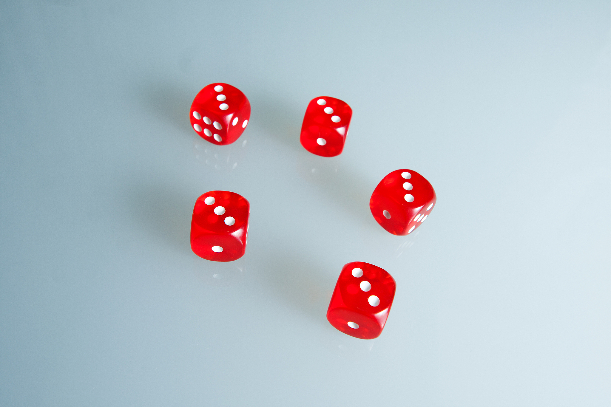 red dice on the glass. five dice with the value of "three"