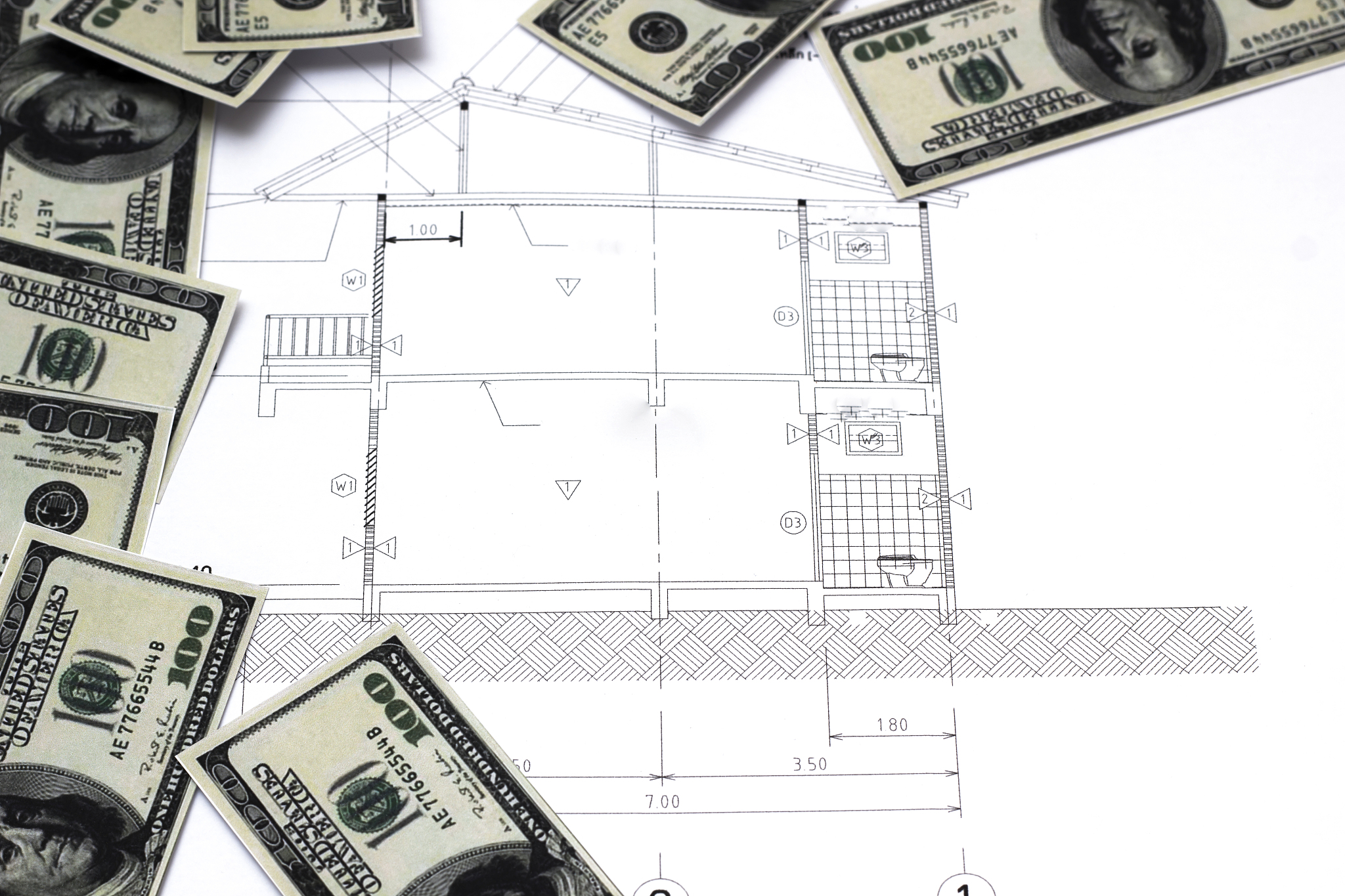dollar banknotes on a construction plan for house building ,conc