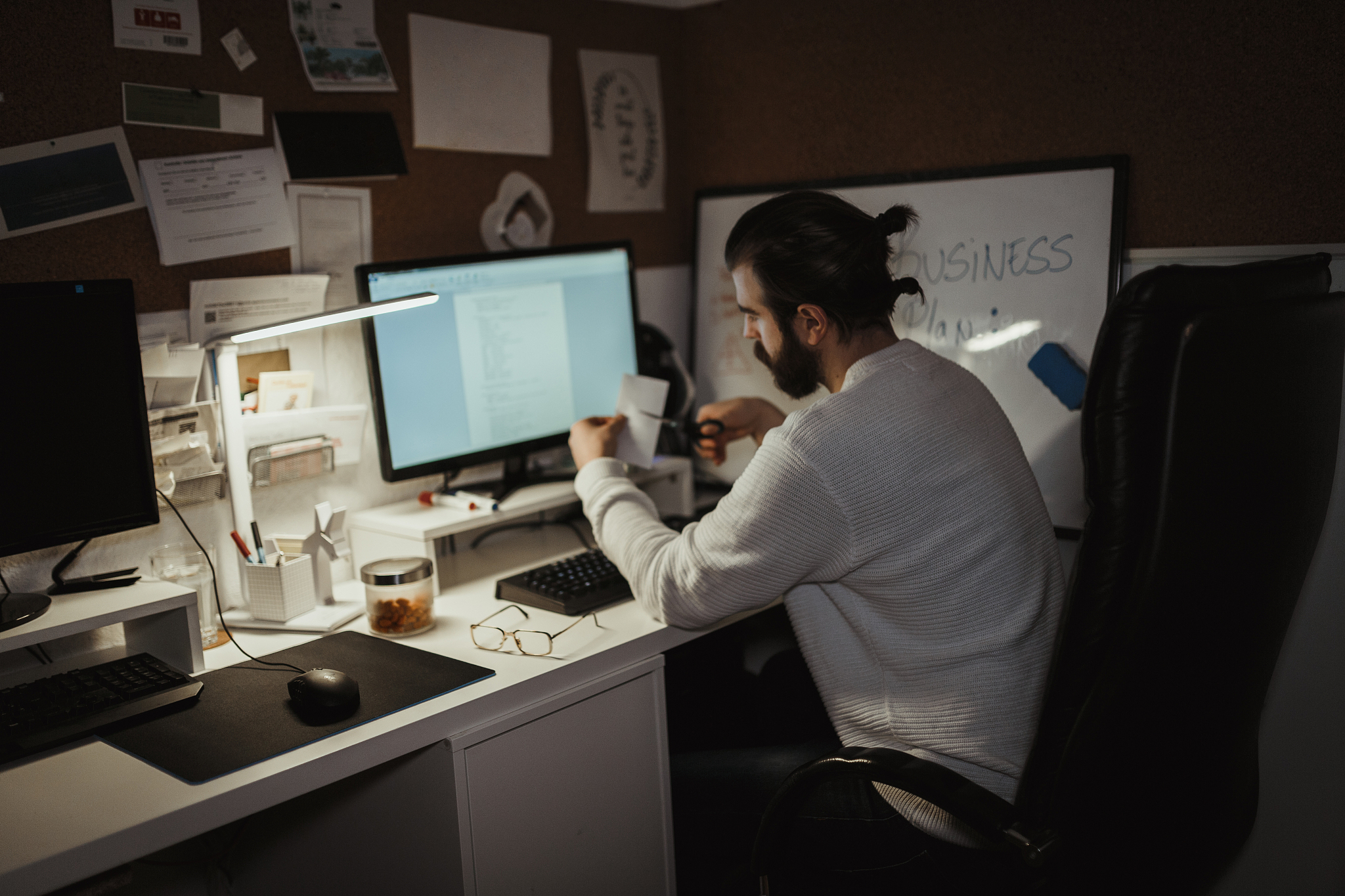man working late and using computer at home