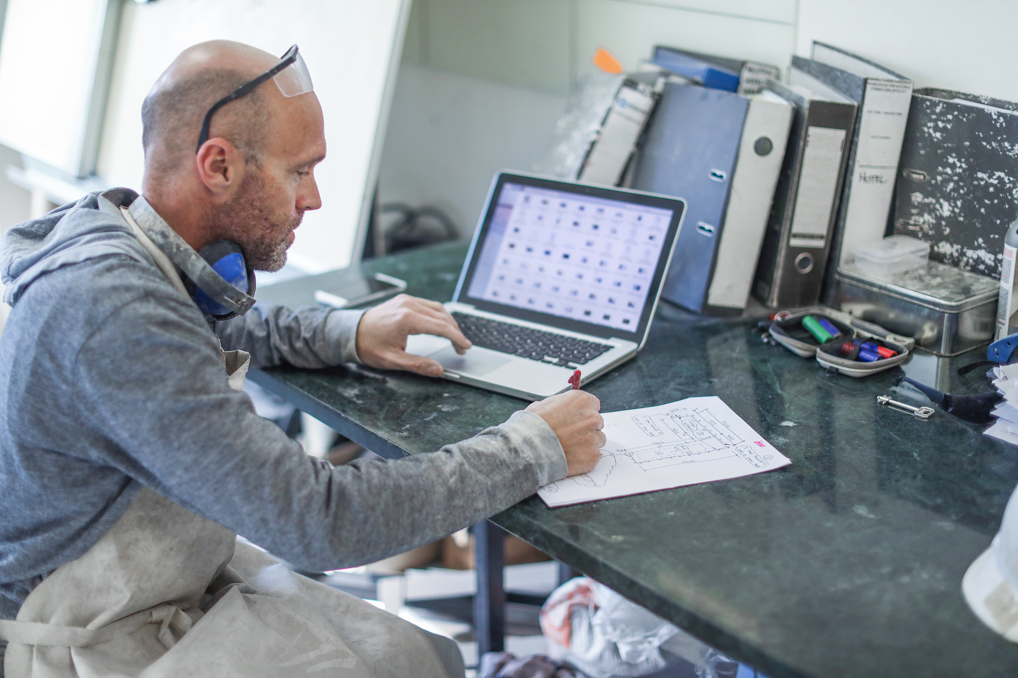 worker planning in his workshop.