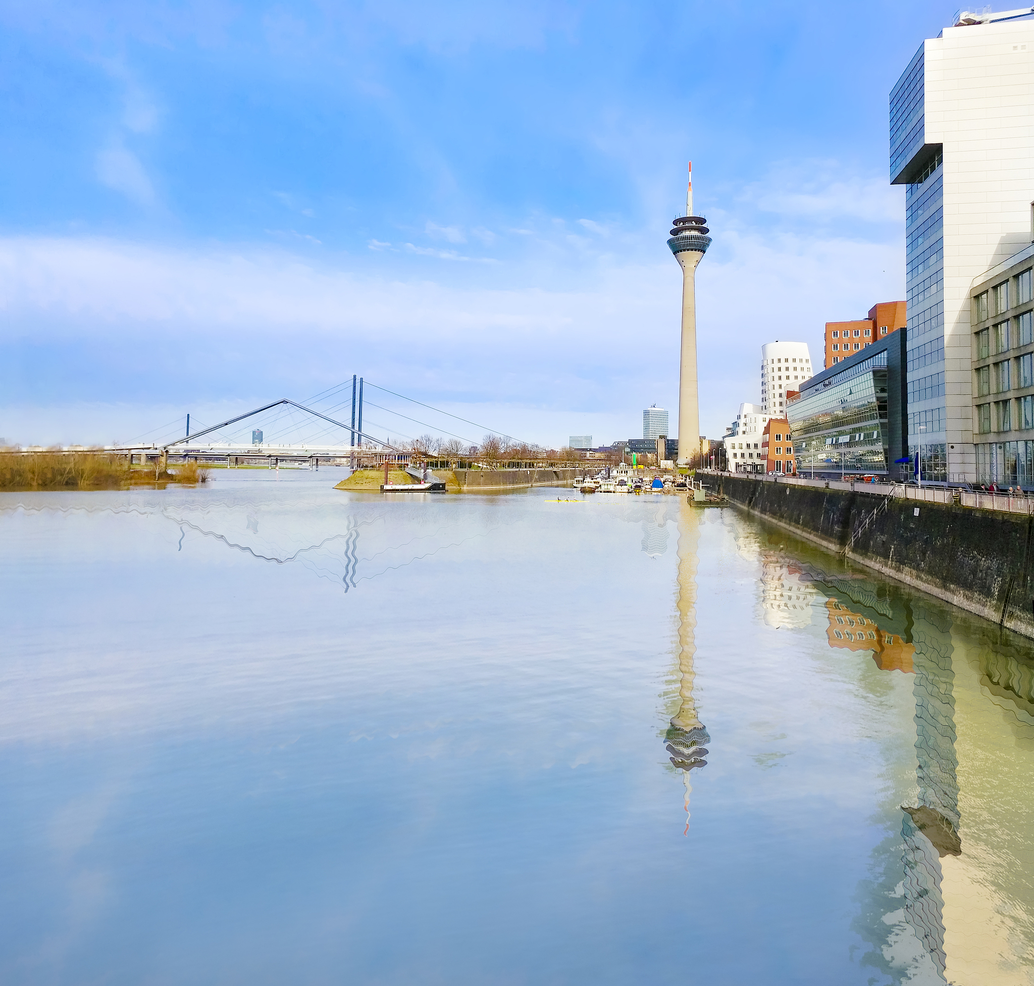 dusseldorf in a sunny summer day with river reflection - citysca