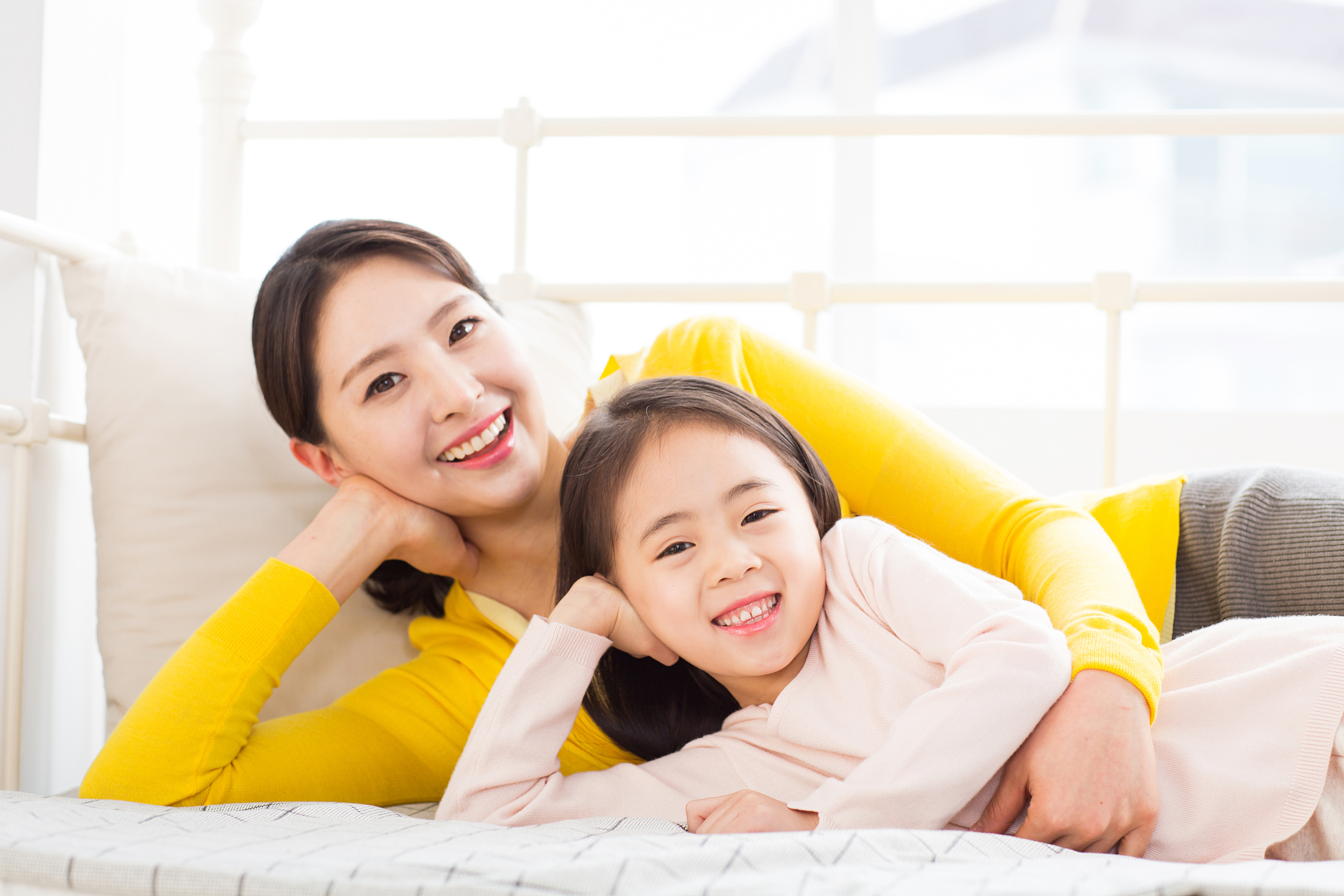mother and daughter smiling together