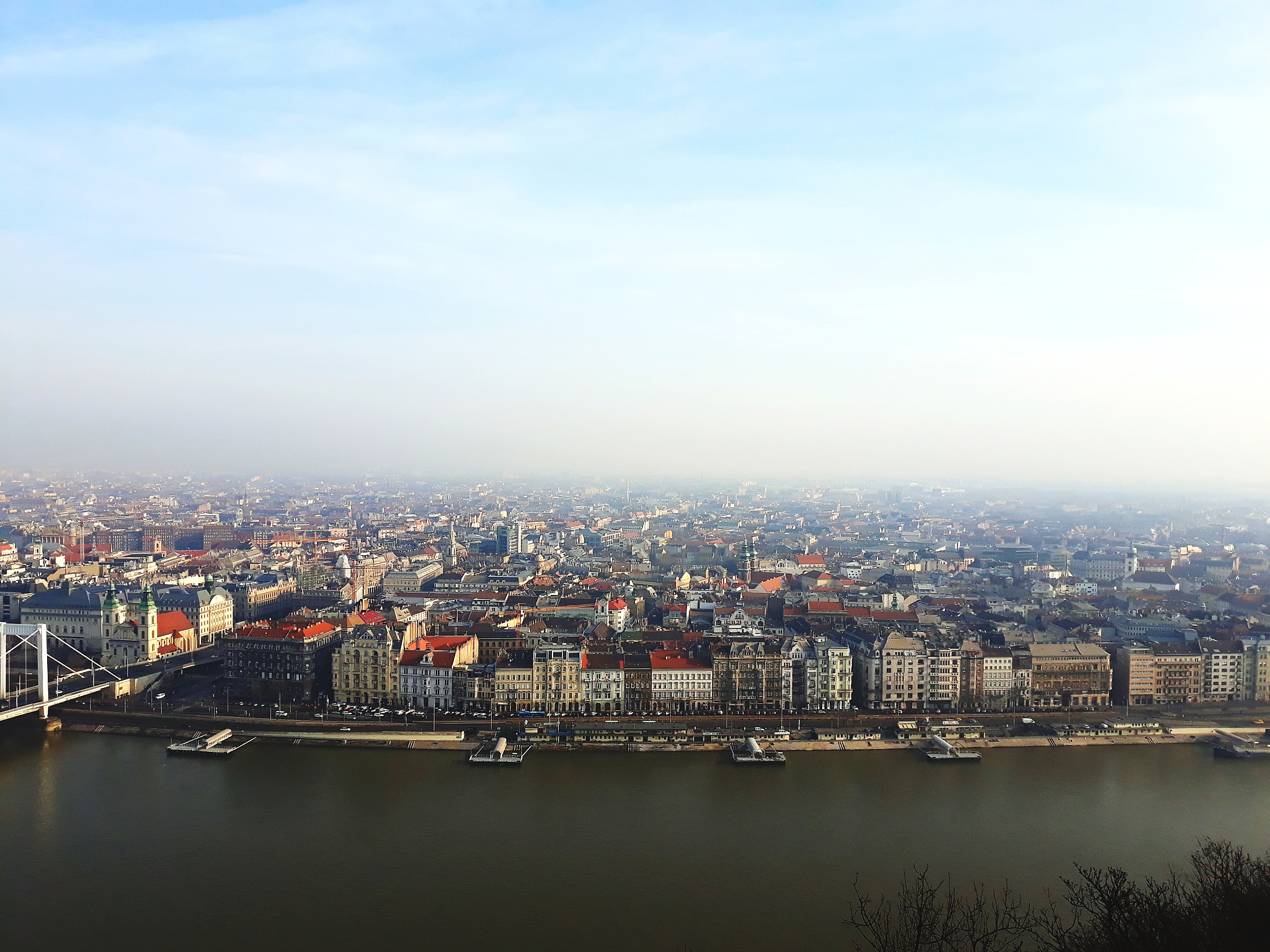 river by cityscape against sky