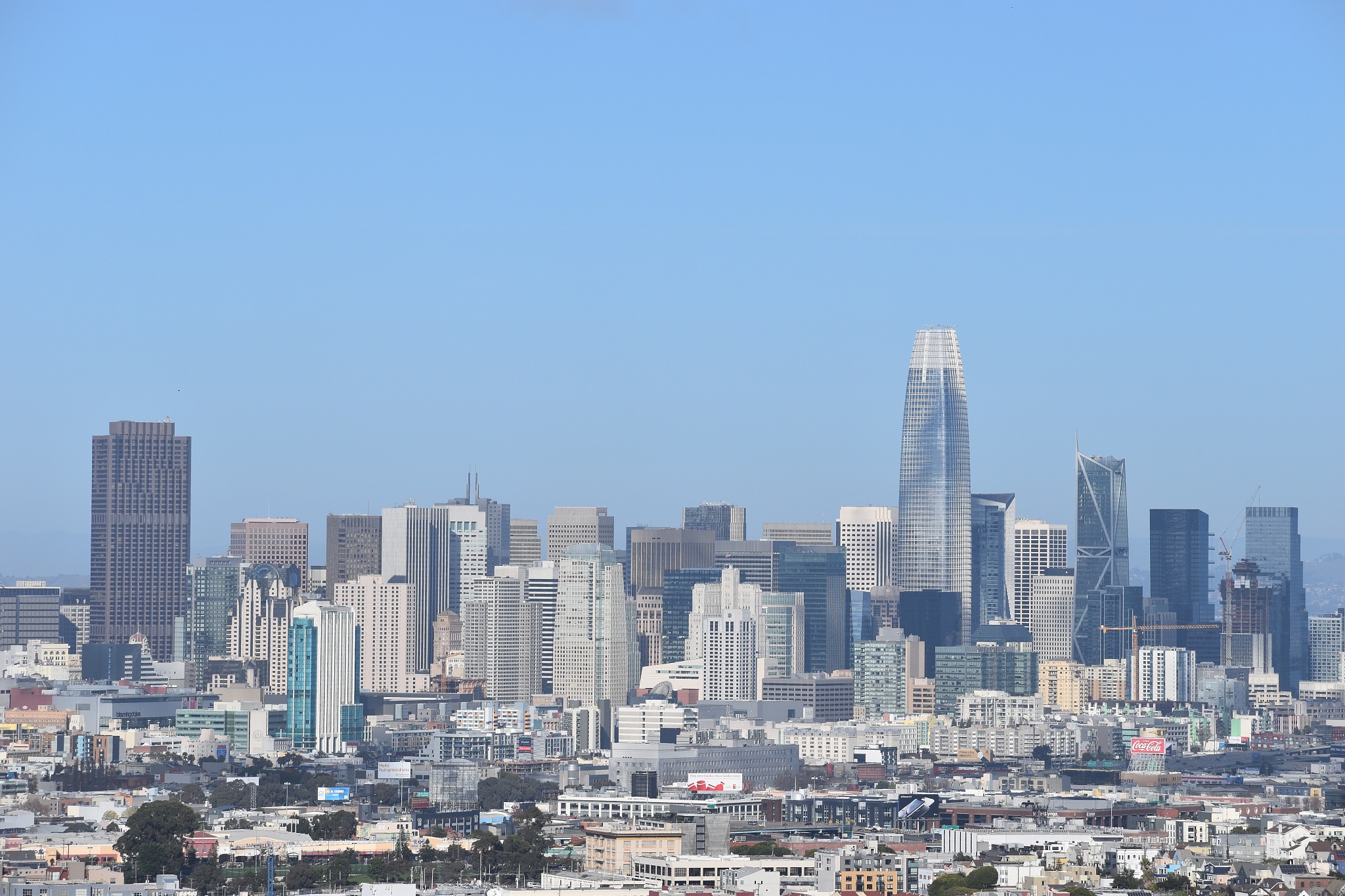 modern buildings in city against clear blue sky