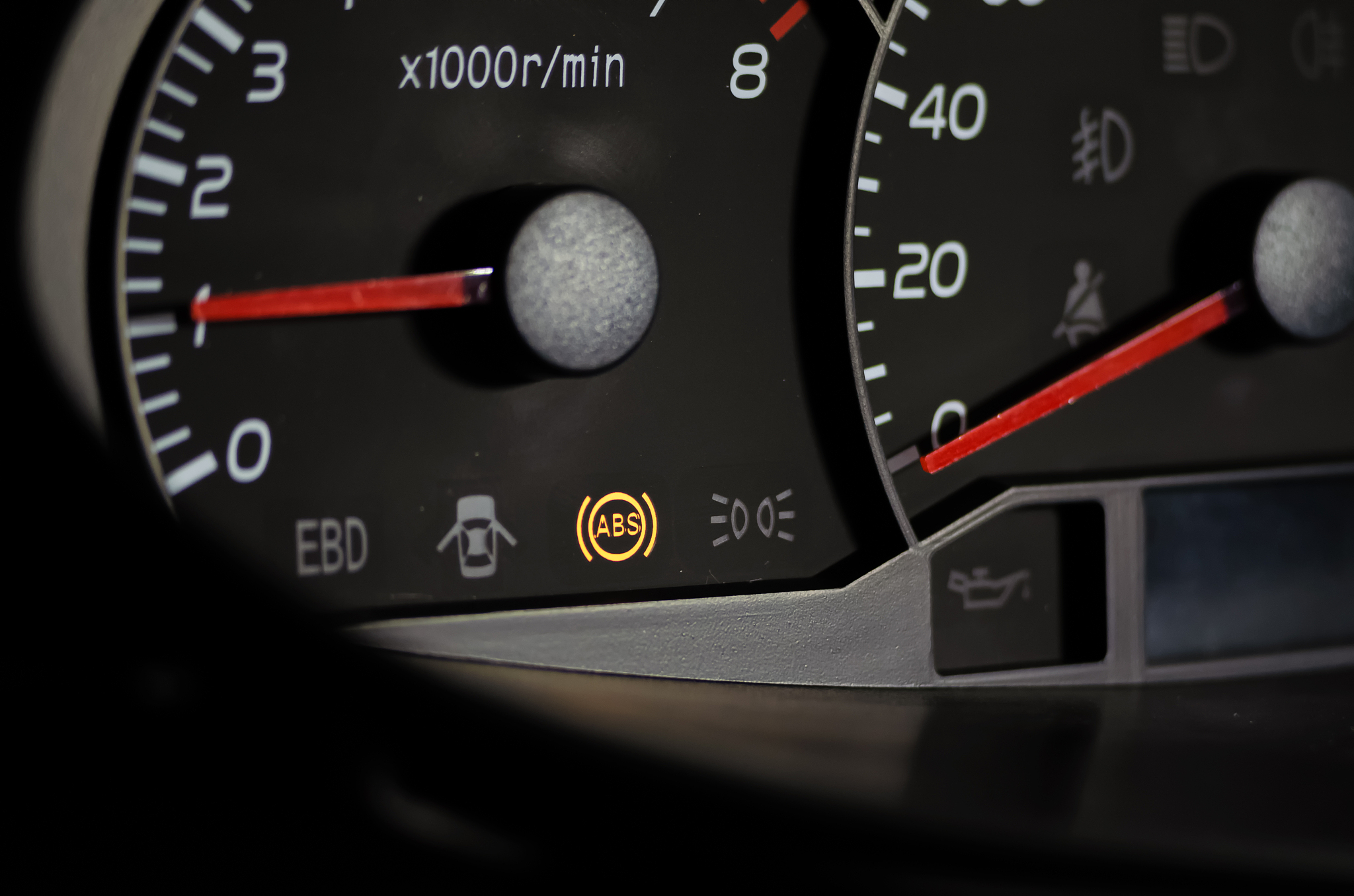the abs sensor lights up orange in the car dashboard.