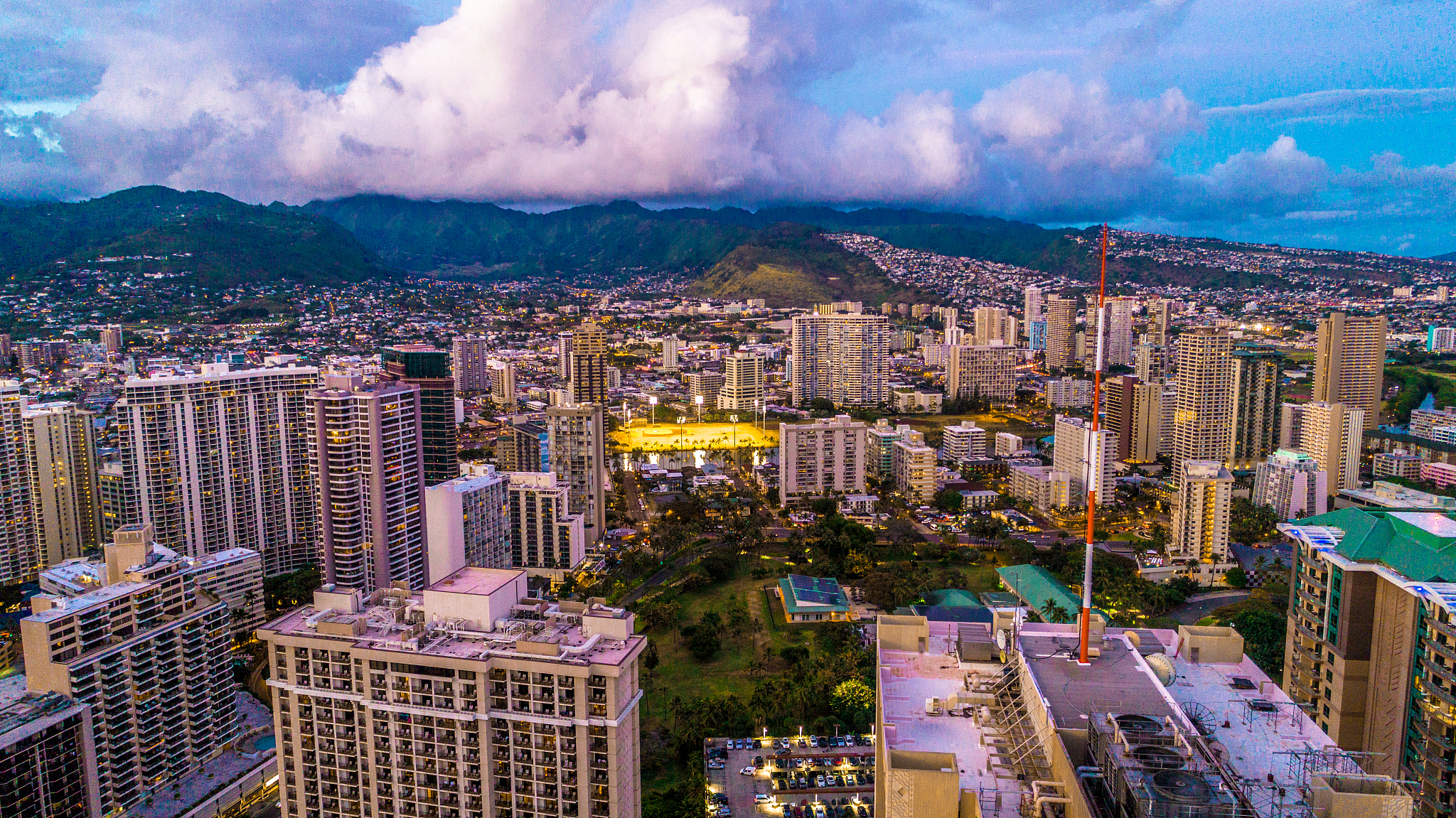 aerial view of honolulu skyscrapers at sunset