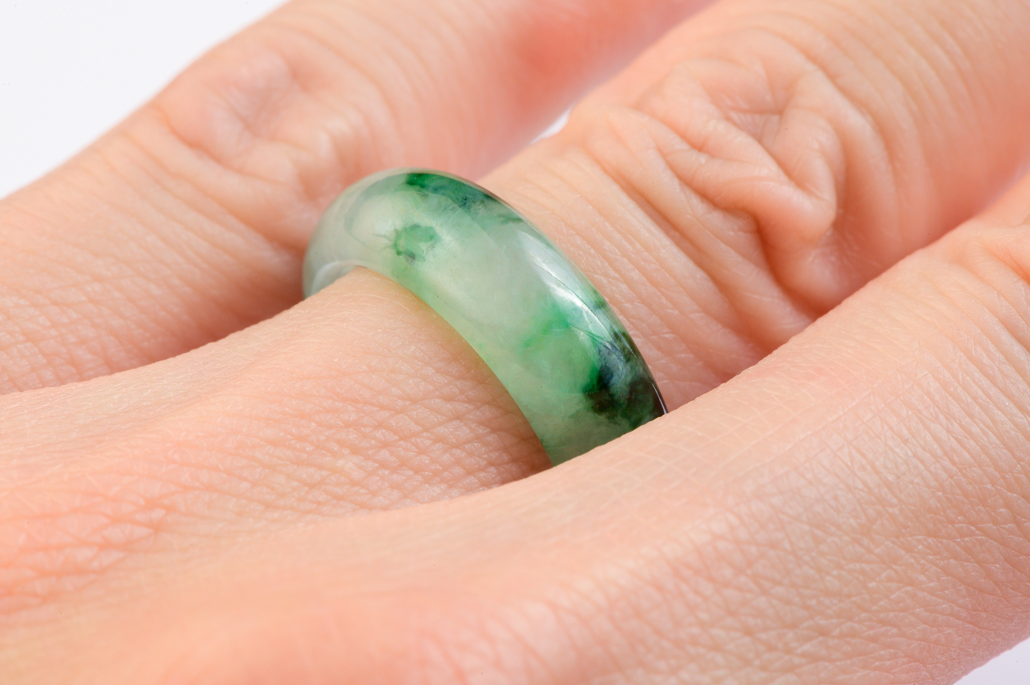 moss in snow jadeite ring on hand