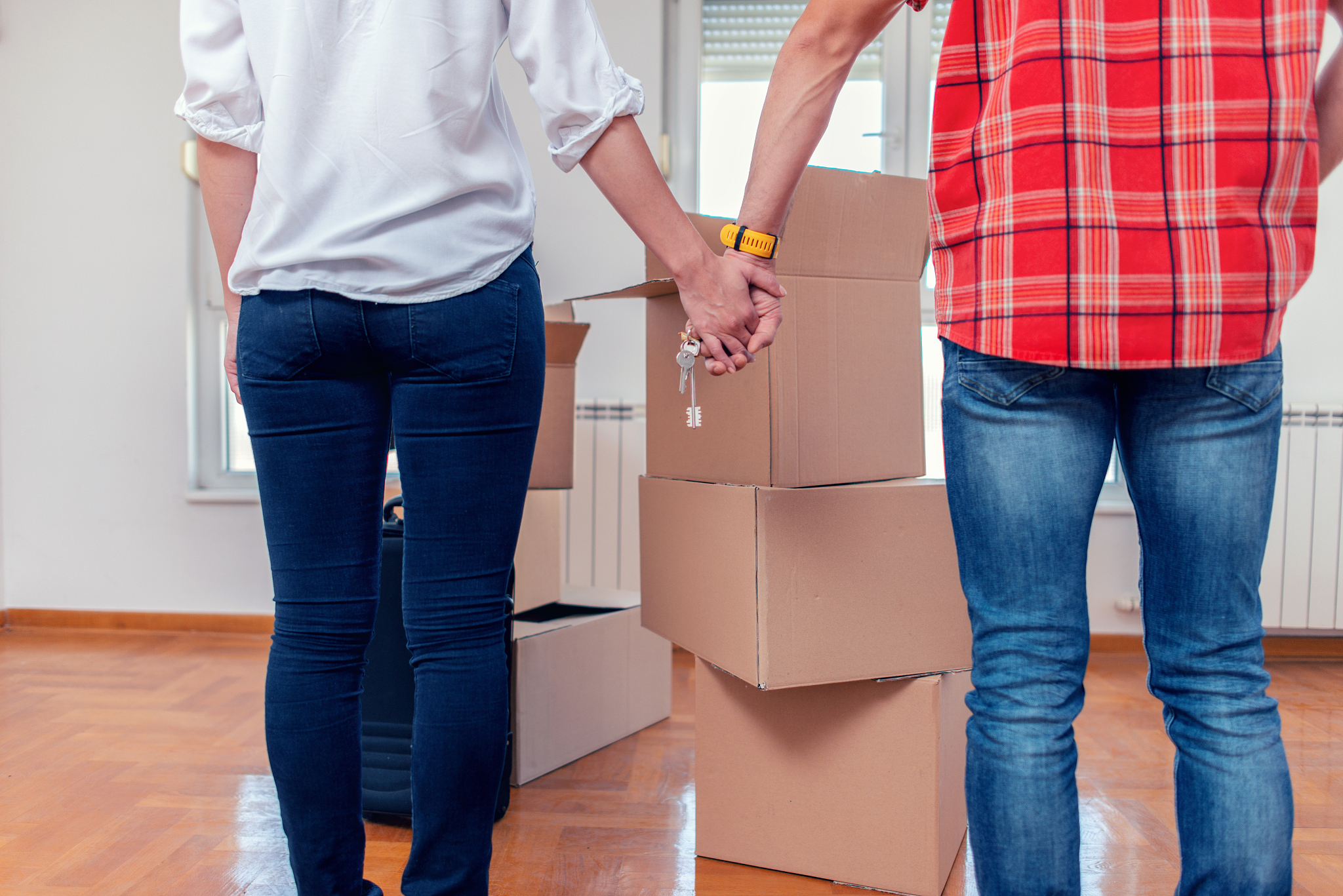 couple holding the keys to their new house
