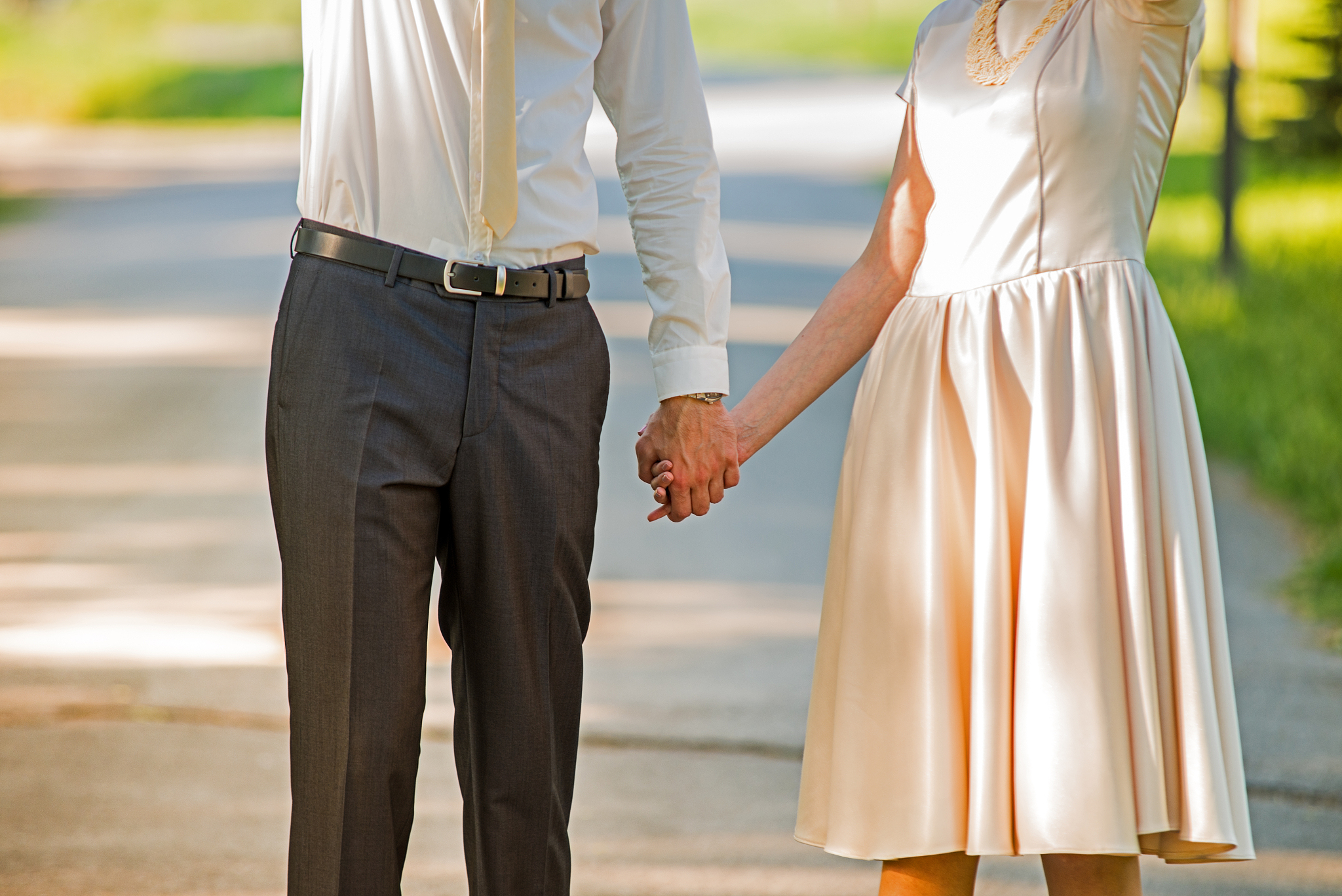 young married couple holding hands