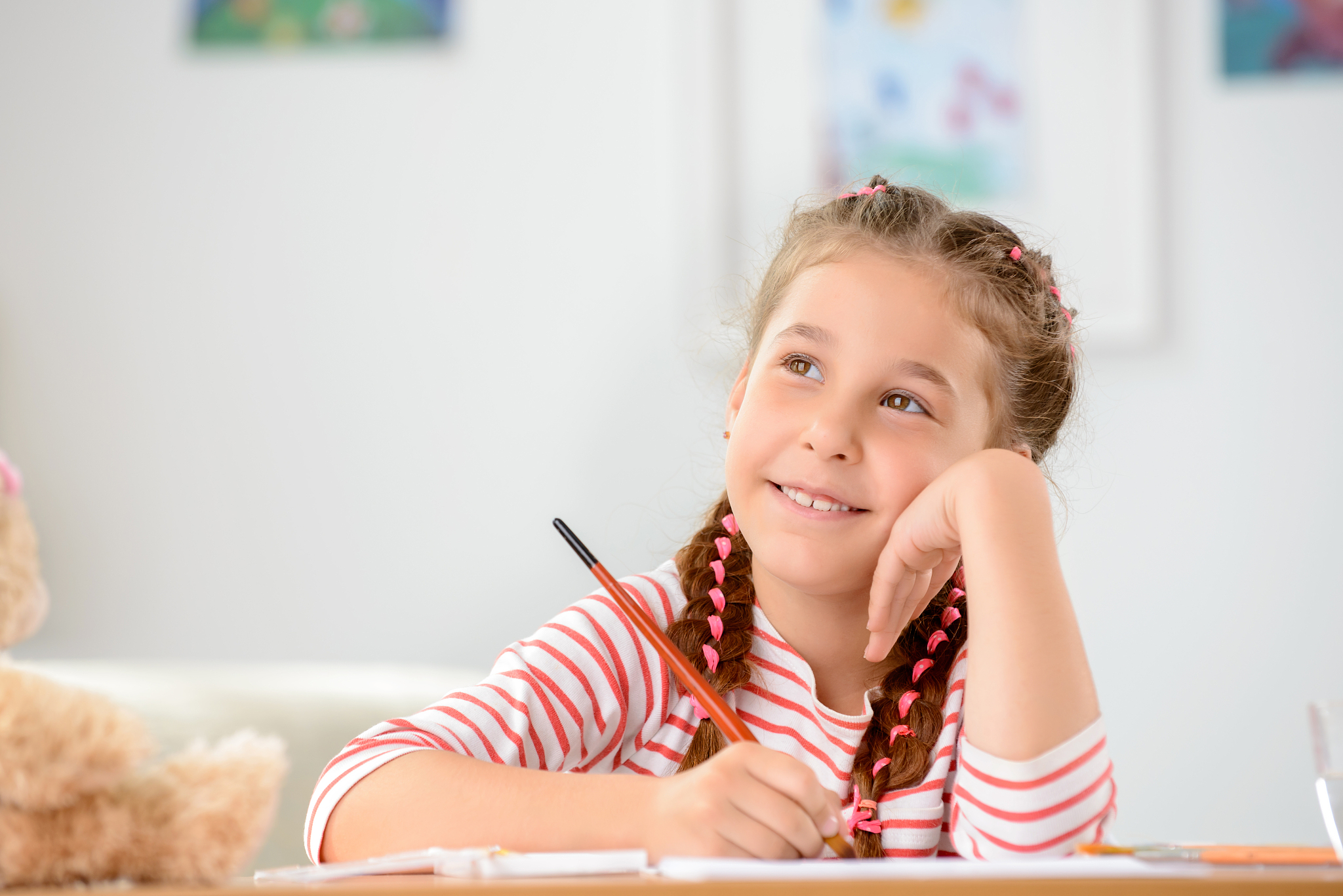 pretty girl holding pencil
