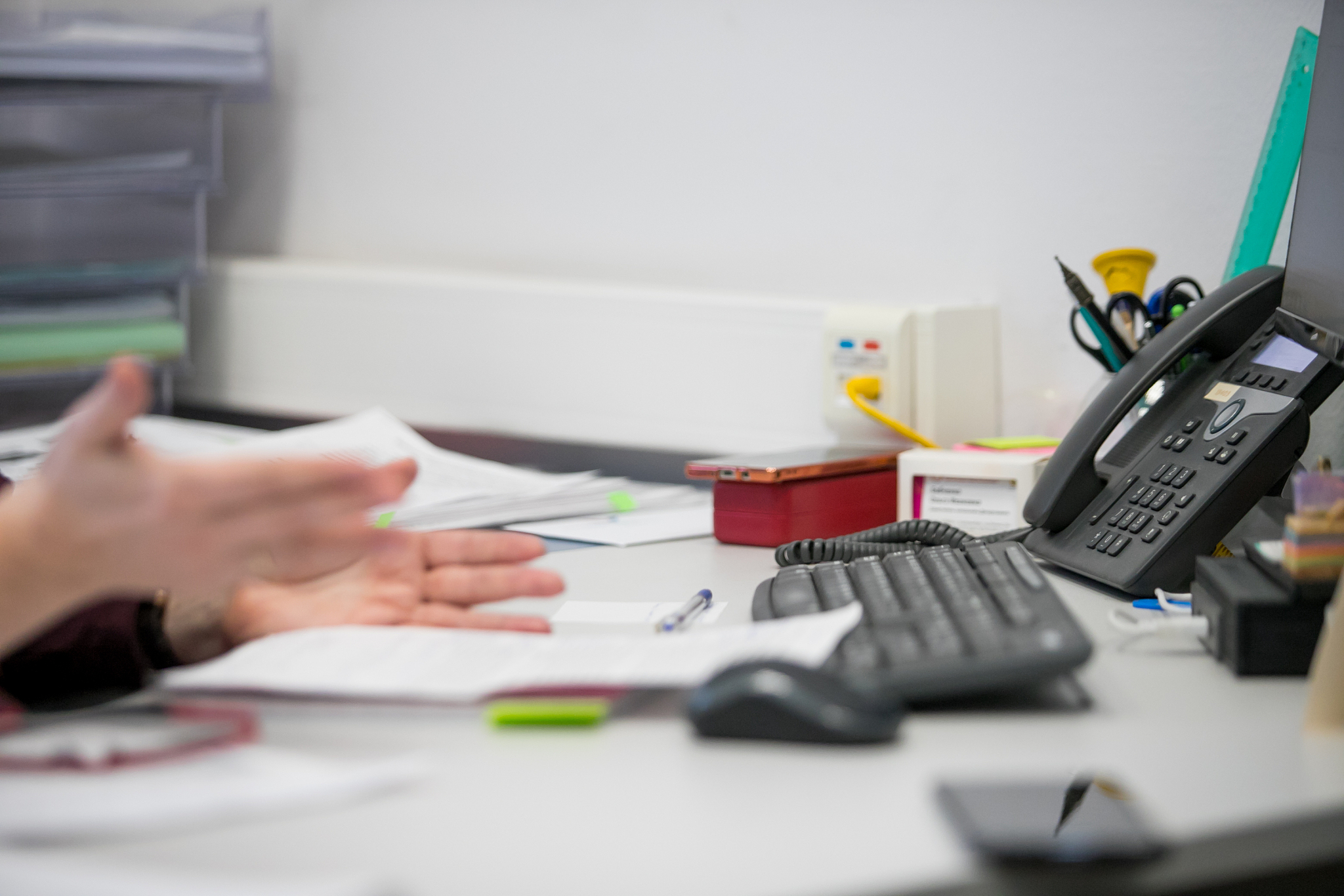 office desk with computer and phone