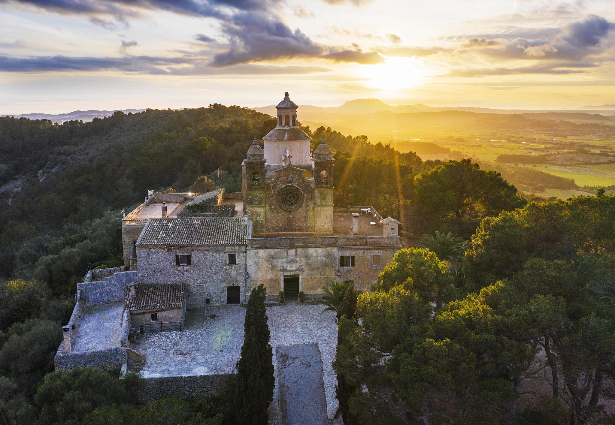 monastery santuari de bonany at sunset, near petra, drone pictur