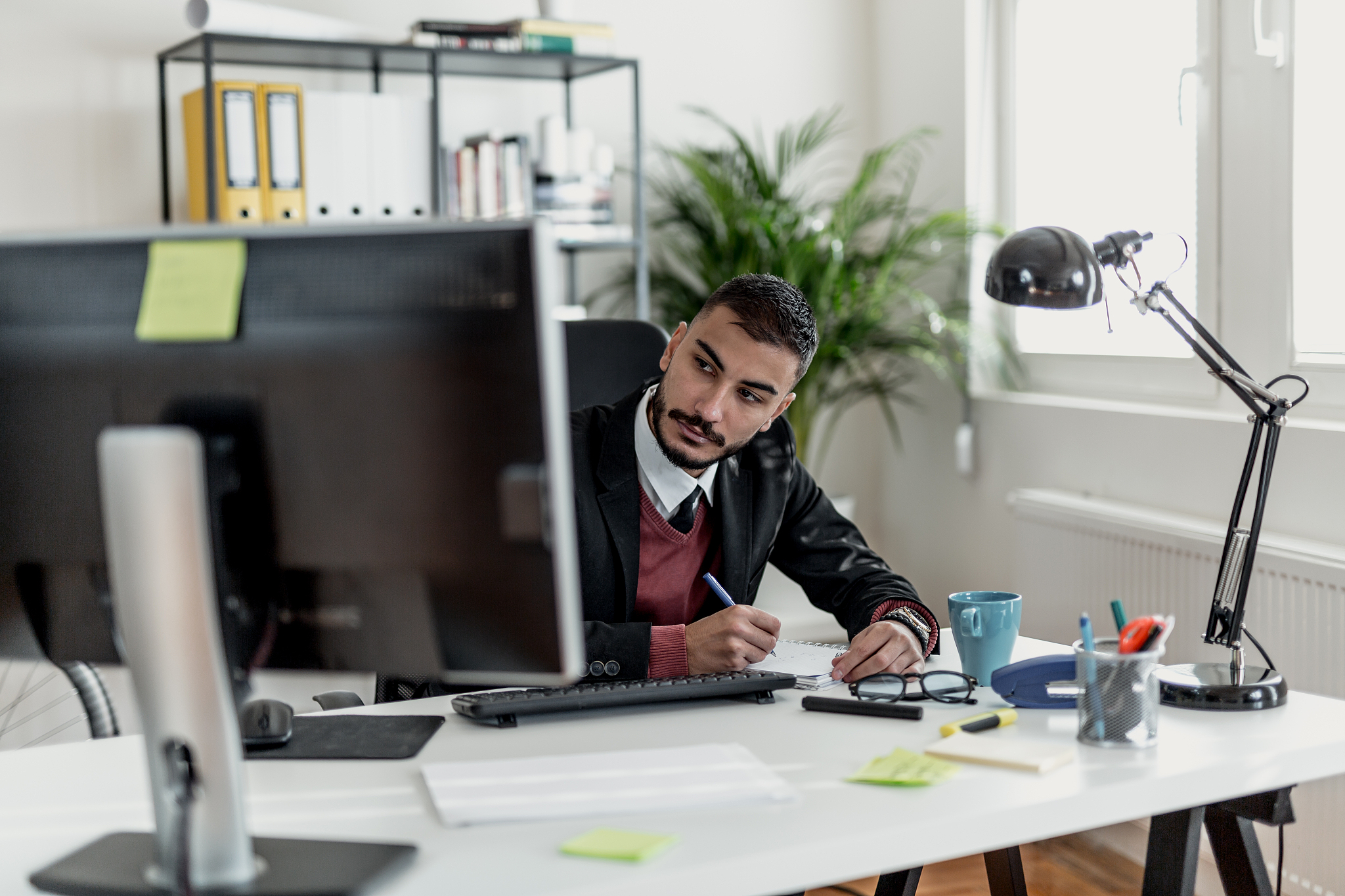 young businessman making a plan in his office