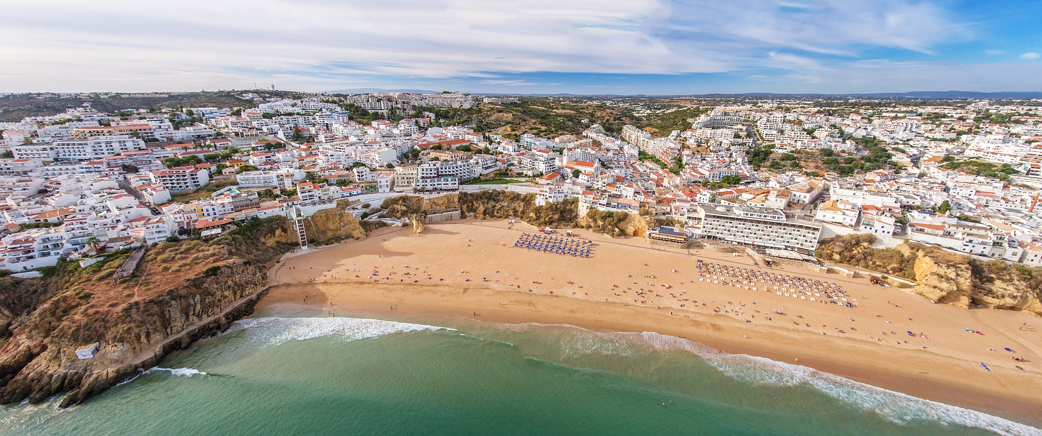 Please plan a day trip for me The trip starts from Lisbon Portugal in the morning and ends at Seville Spain at night passing by several towns in the Algarve region which must include Silves Also keep