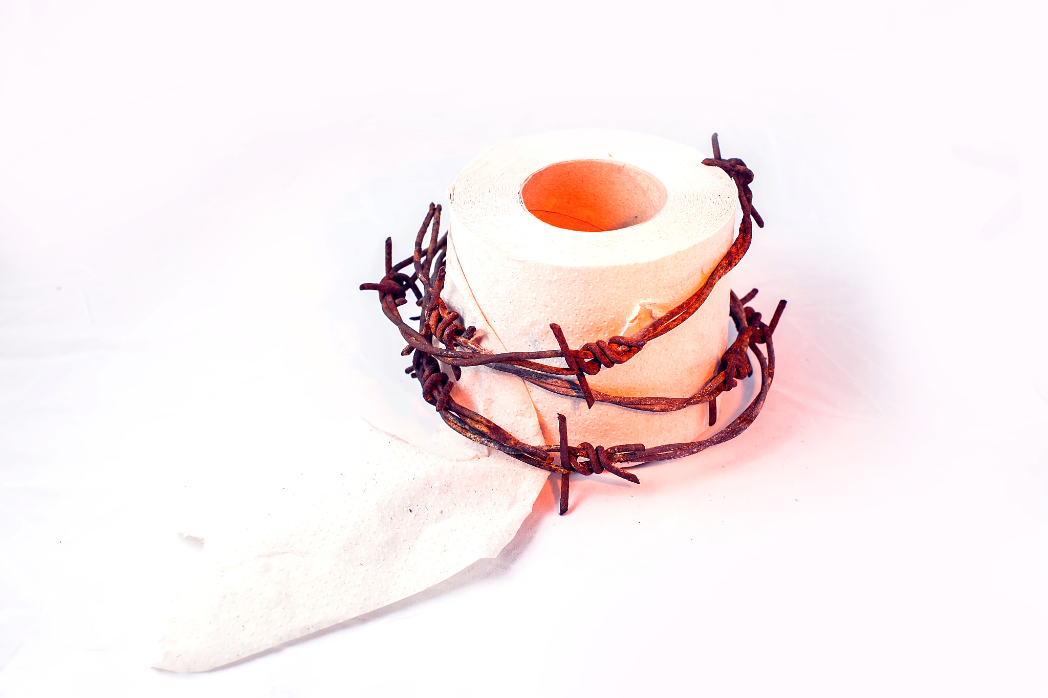 toilet paper with barbed wire around it. people, healthcare and 