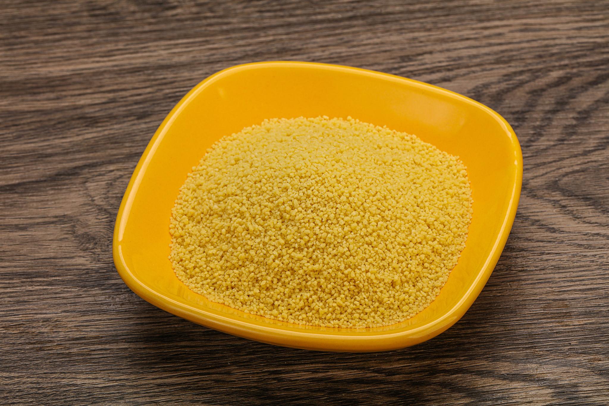 raw cous cous heap in the bowl