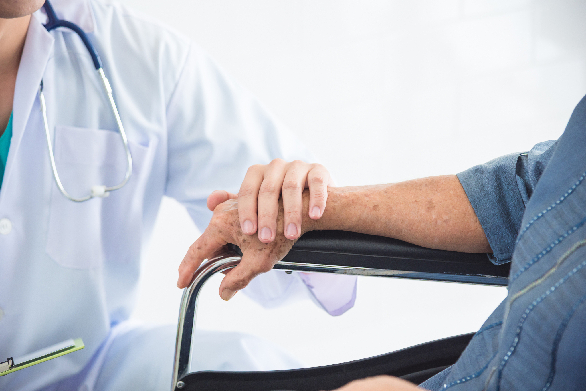 midsection of doctor consoling patient