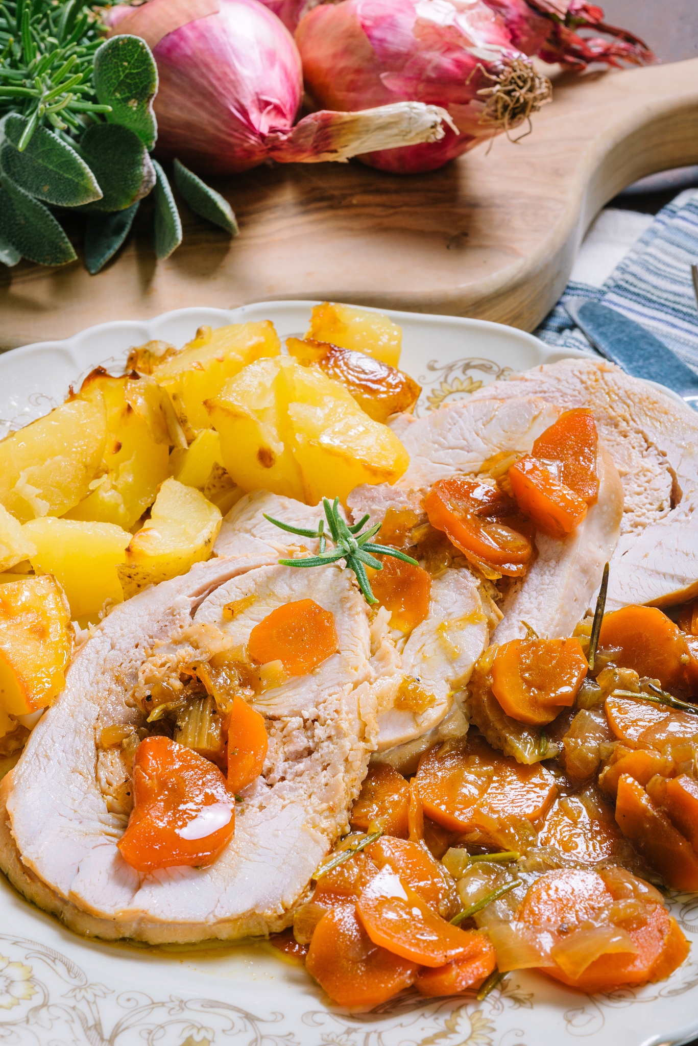 roast turkey with baked potatoes and carrots