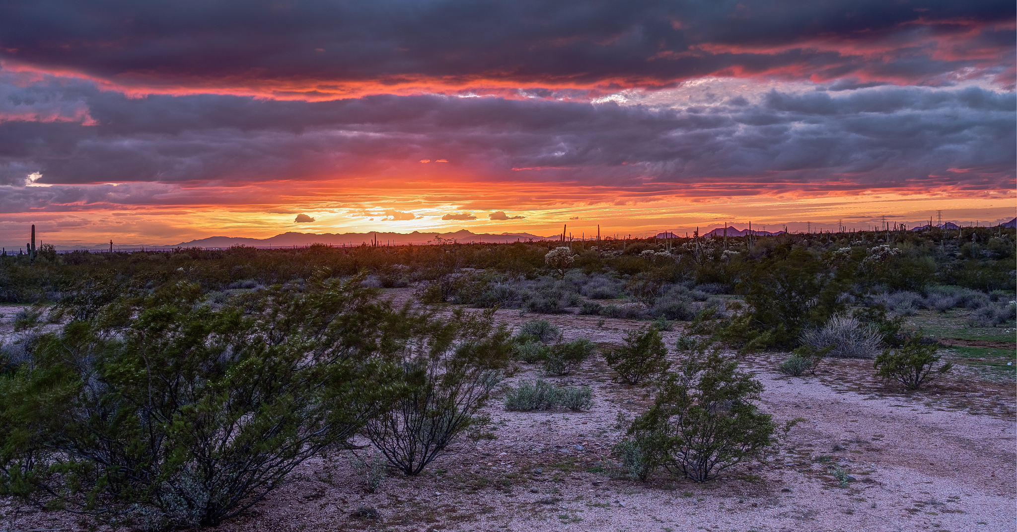 sun sets on the superstition mountains