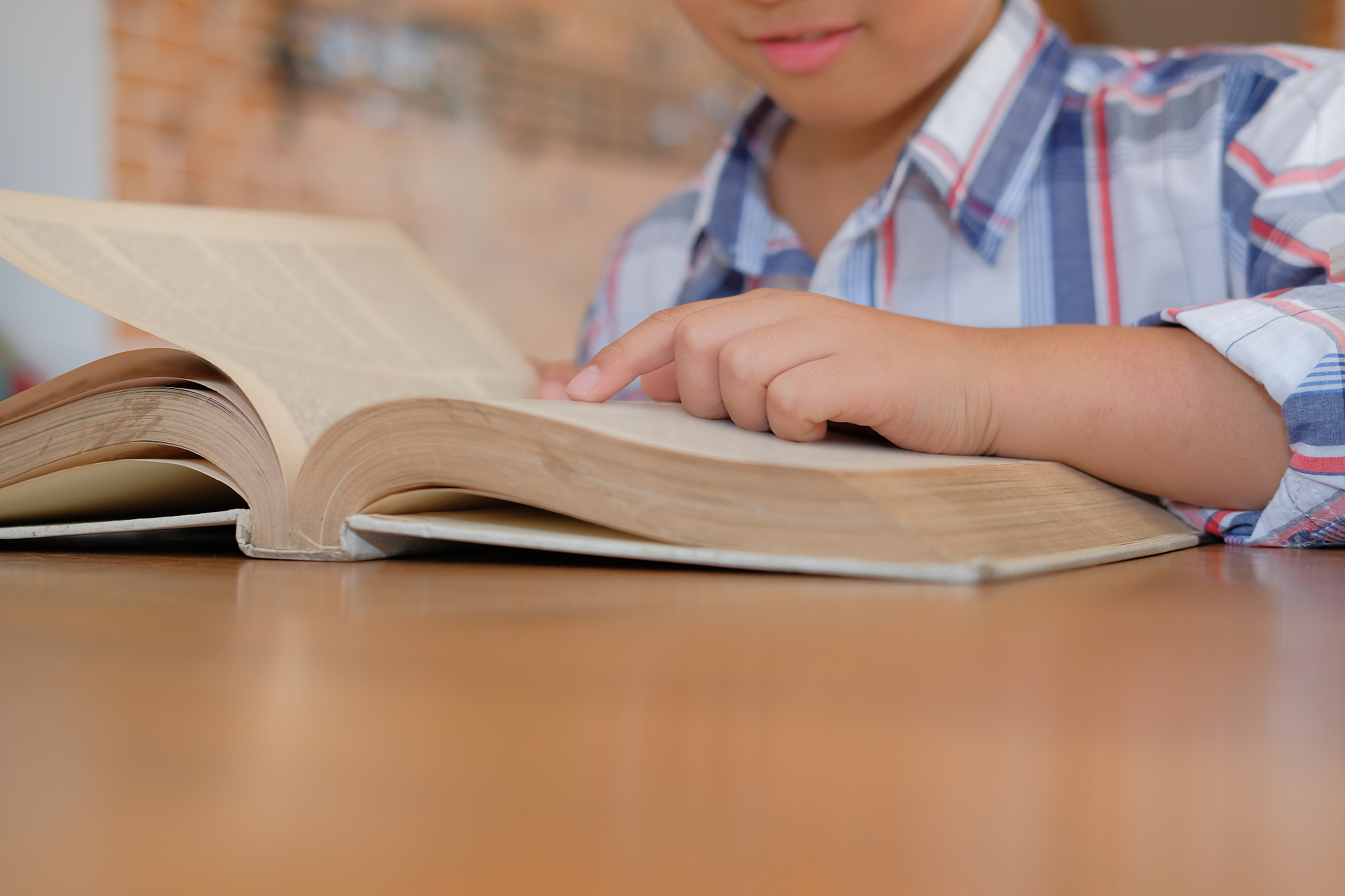 little asian kid boy child children studying reading book.