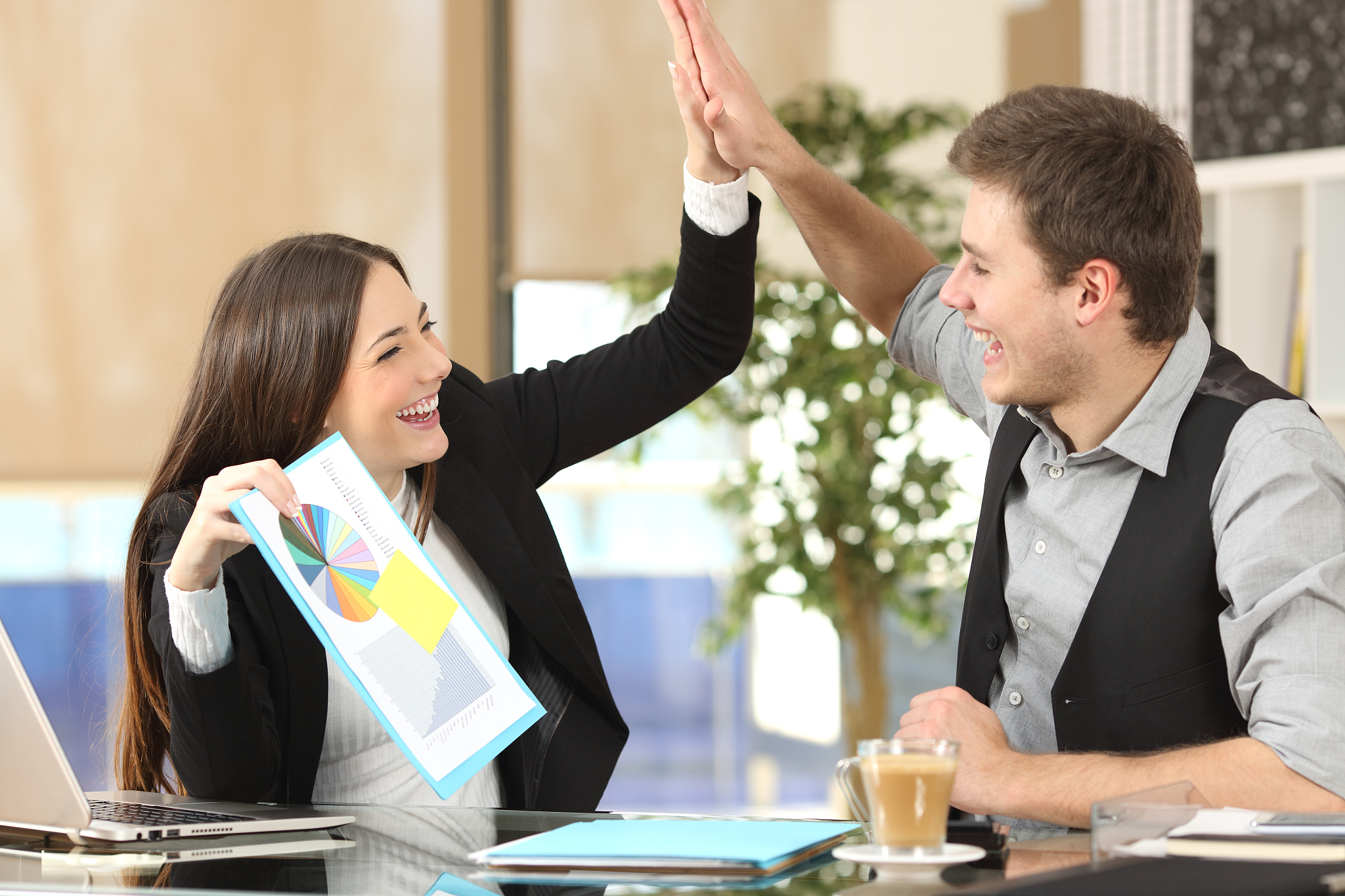 successful coworkers celebrating good results