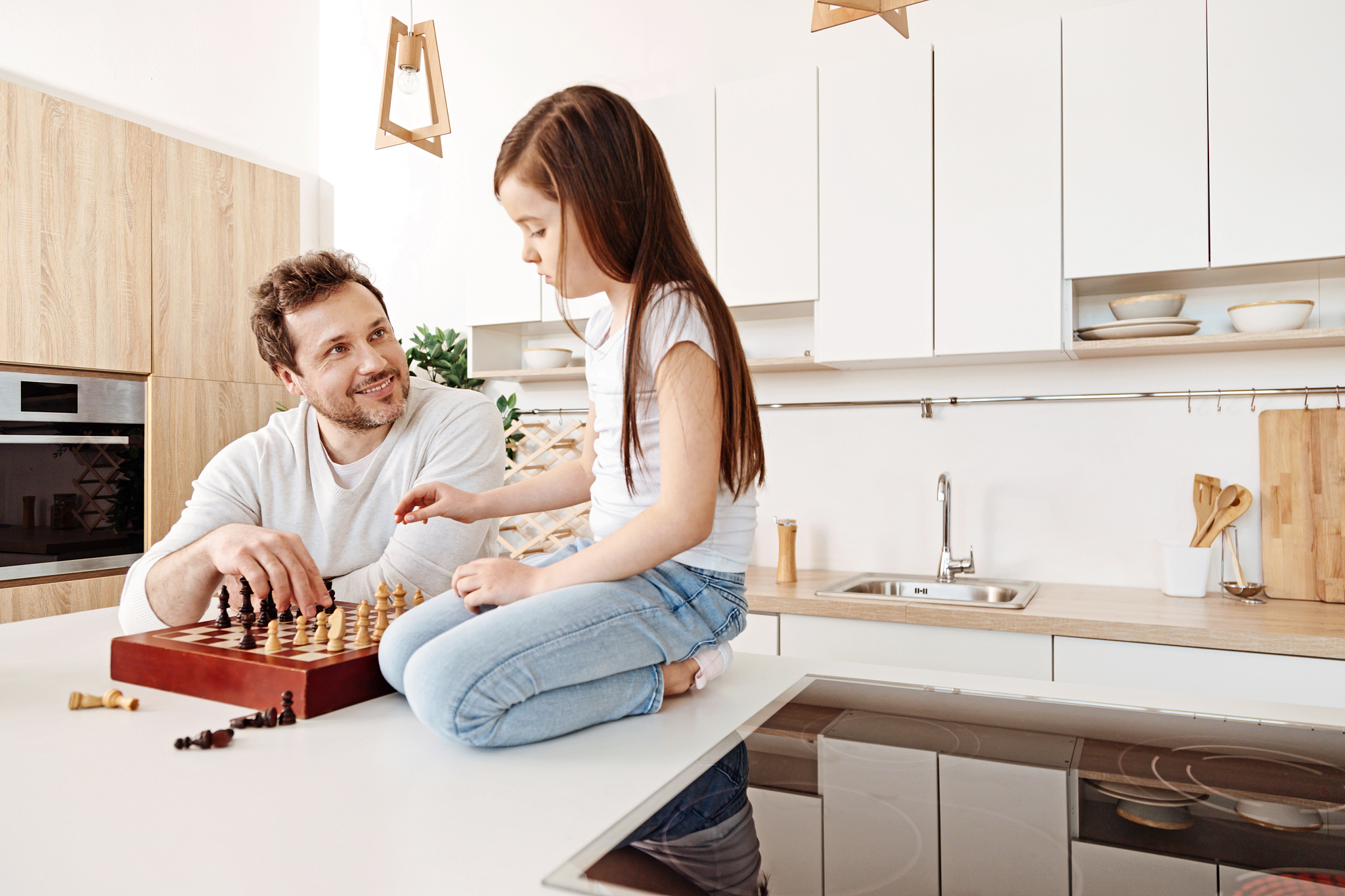 father helping his daughter with her next move