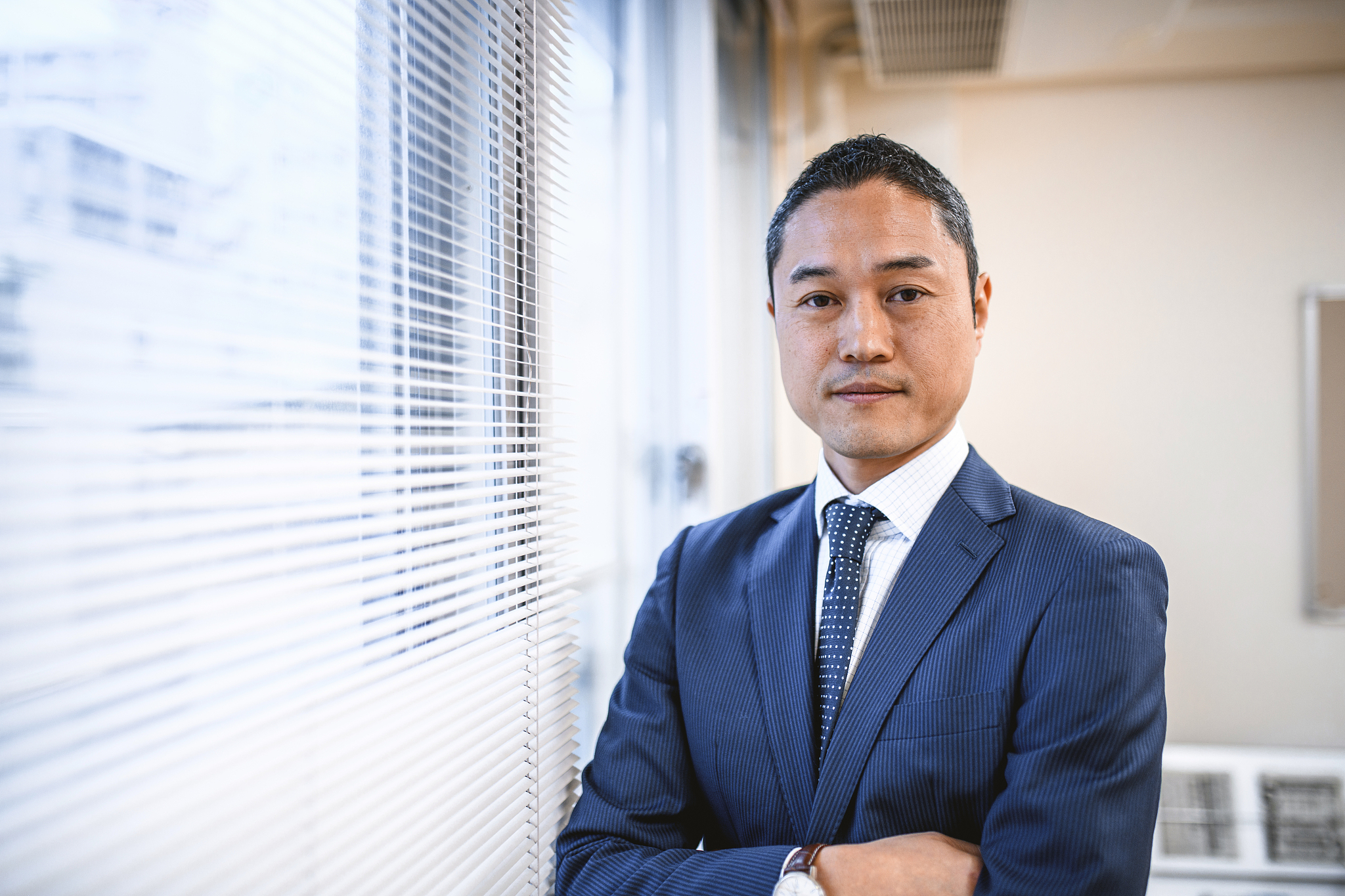 confident japanese hospital administrator looking at camera