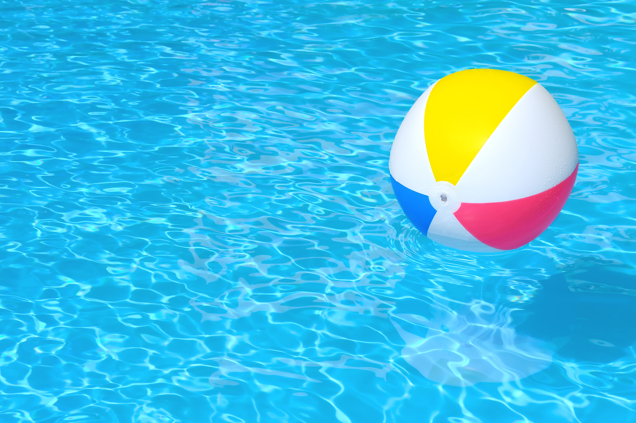 inflatable ball floating in swimming pool
